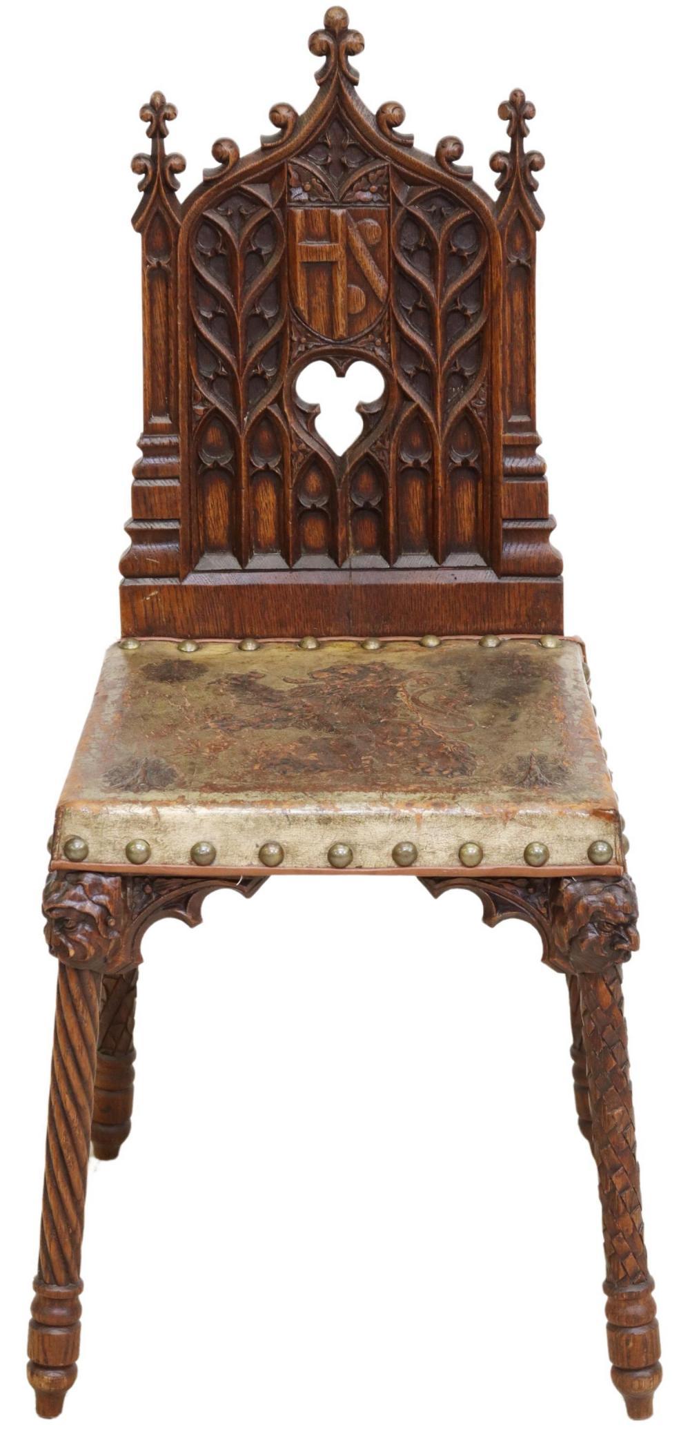 19th-Century French Gothic Revival Hall Chair 

Steeped in history and artistry, this 19th-century French Gothic Revival hall chair is a true collector’s piece. Crafted from rich oak, its spire-form back features intricate tracery, a noble shield,