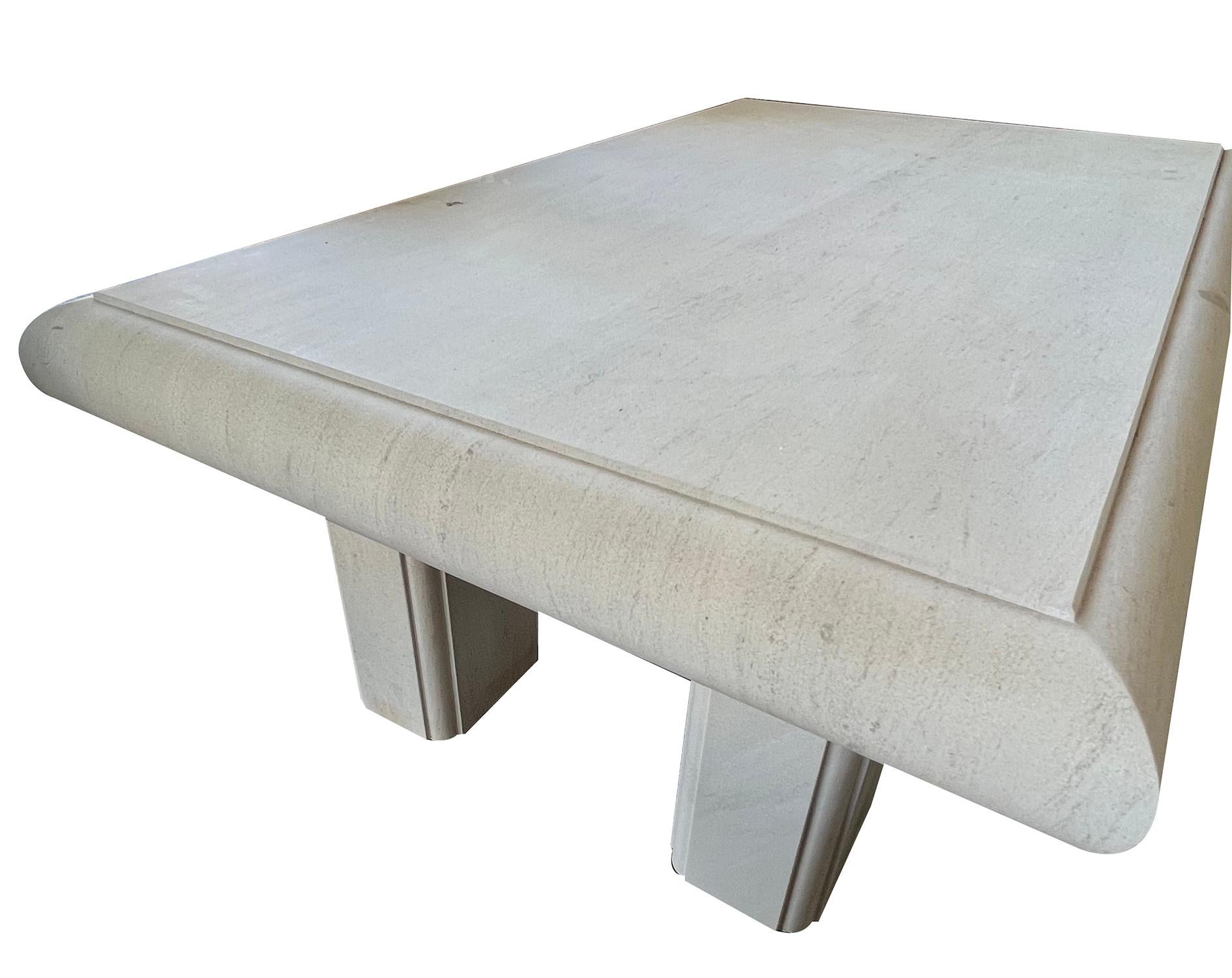 the thick rectangular top with bullnose edge raised on 4 detached rectilinear supports; tables are custom made in Belgium so variations in stone will occur