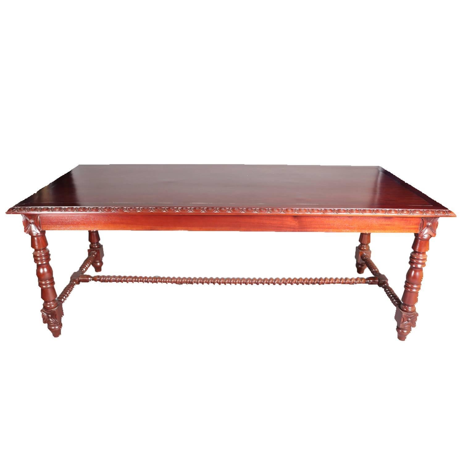 French style carved mahogany dining, conference or library table features egg-and-dart trimmed top above a deep apron and raised on rosette jointed turned legs connected with H-form barley twist stretcher, 20th century


Measures: 30