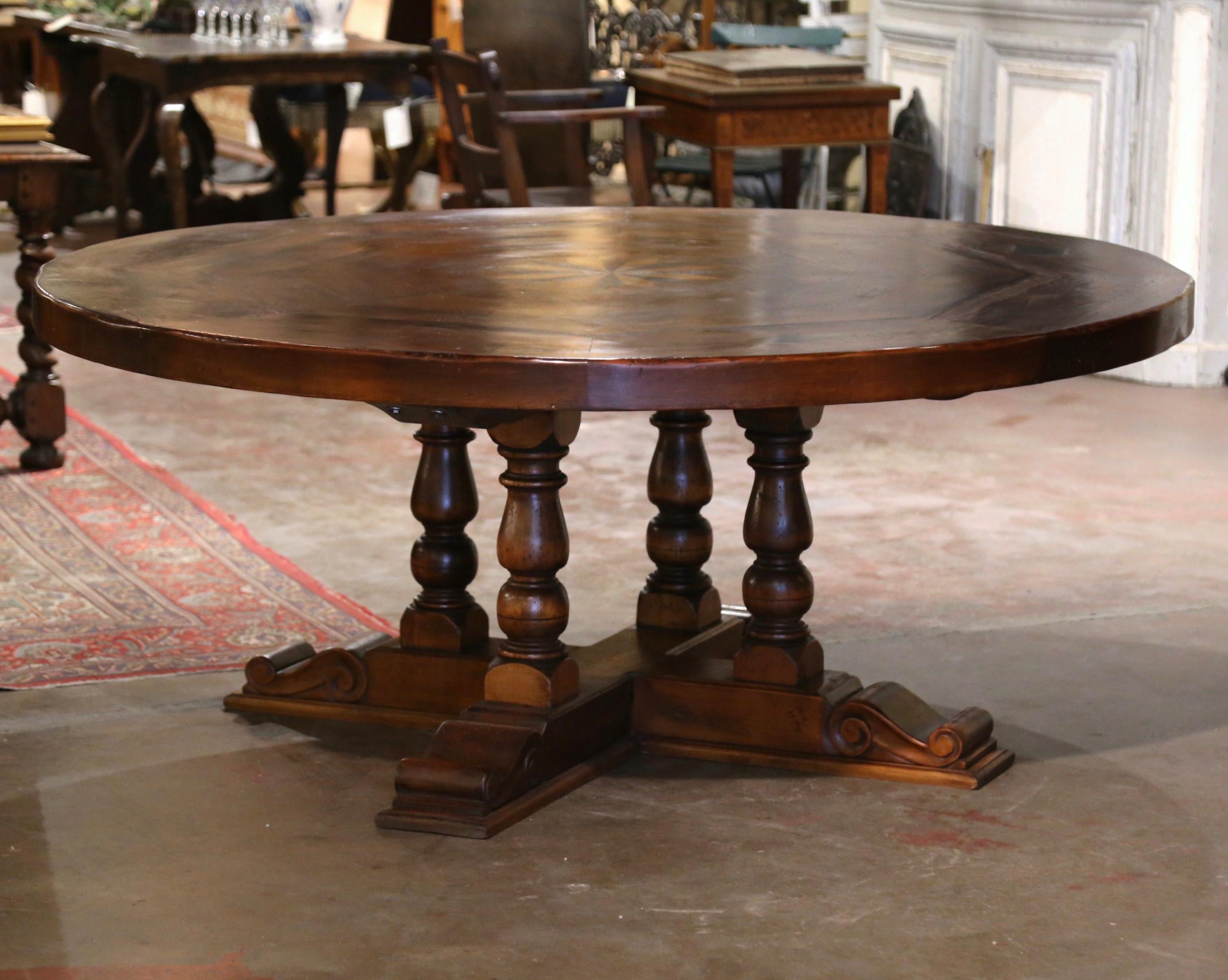 This elegant six foot round table stands on a sturdy pedestal base with four hand turned columns, and supported by hand carved molded flat shoe feet for ultimate stability. The intricate 3
