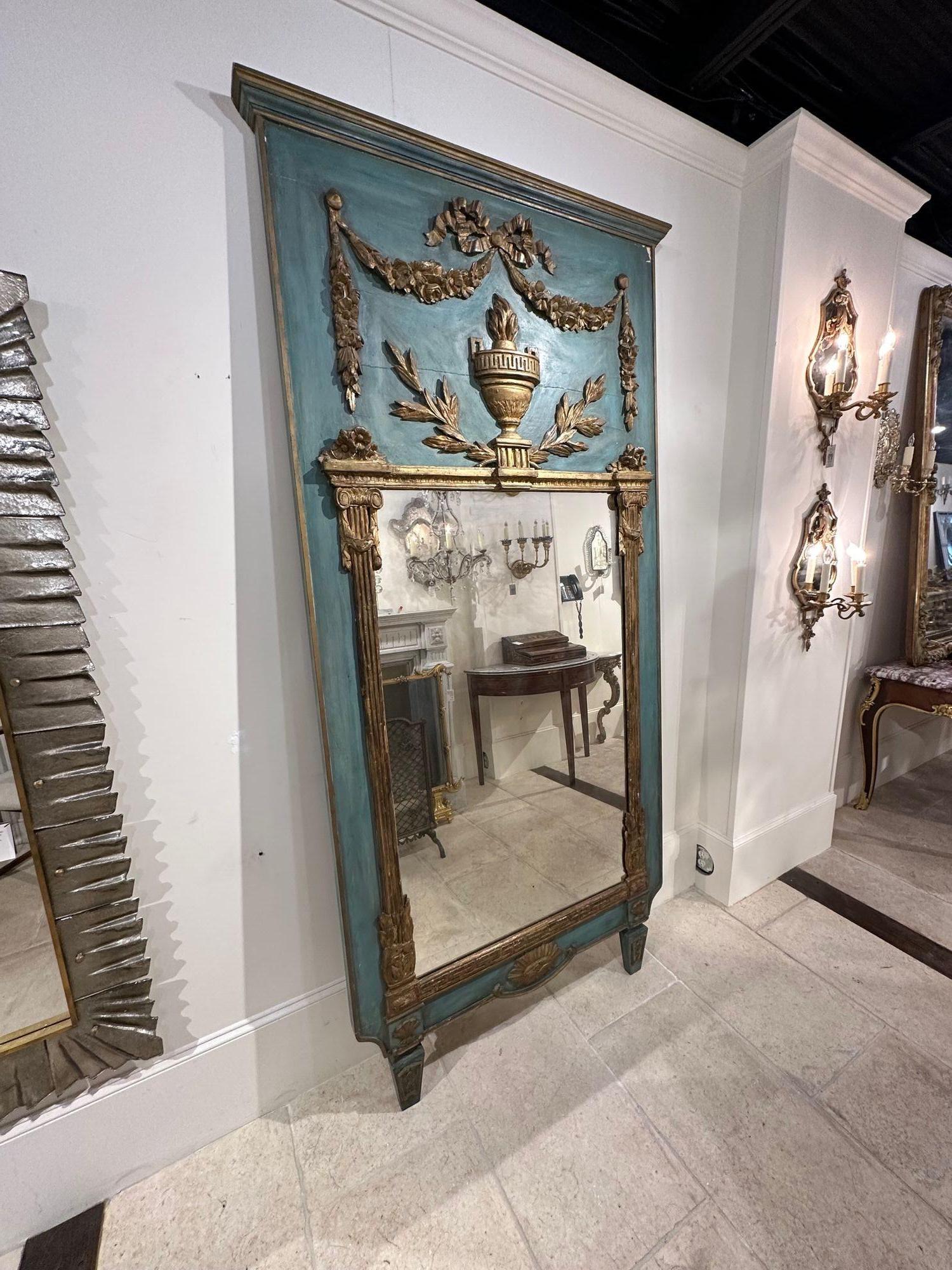 Beautiful 19th century French carved and parcel gilt Neo-classical trumeau mirror. Circa 1850. Perfect for today's transitional designs!