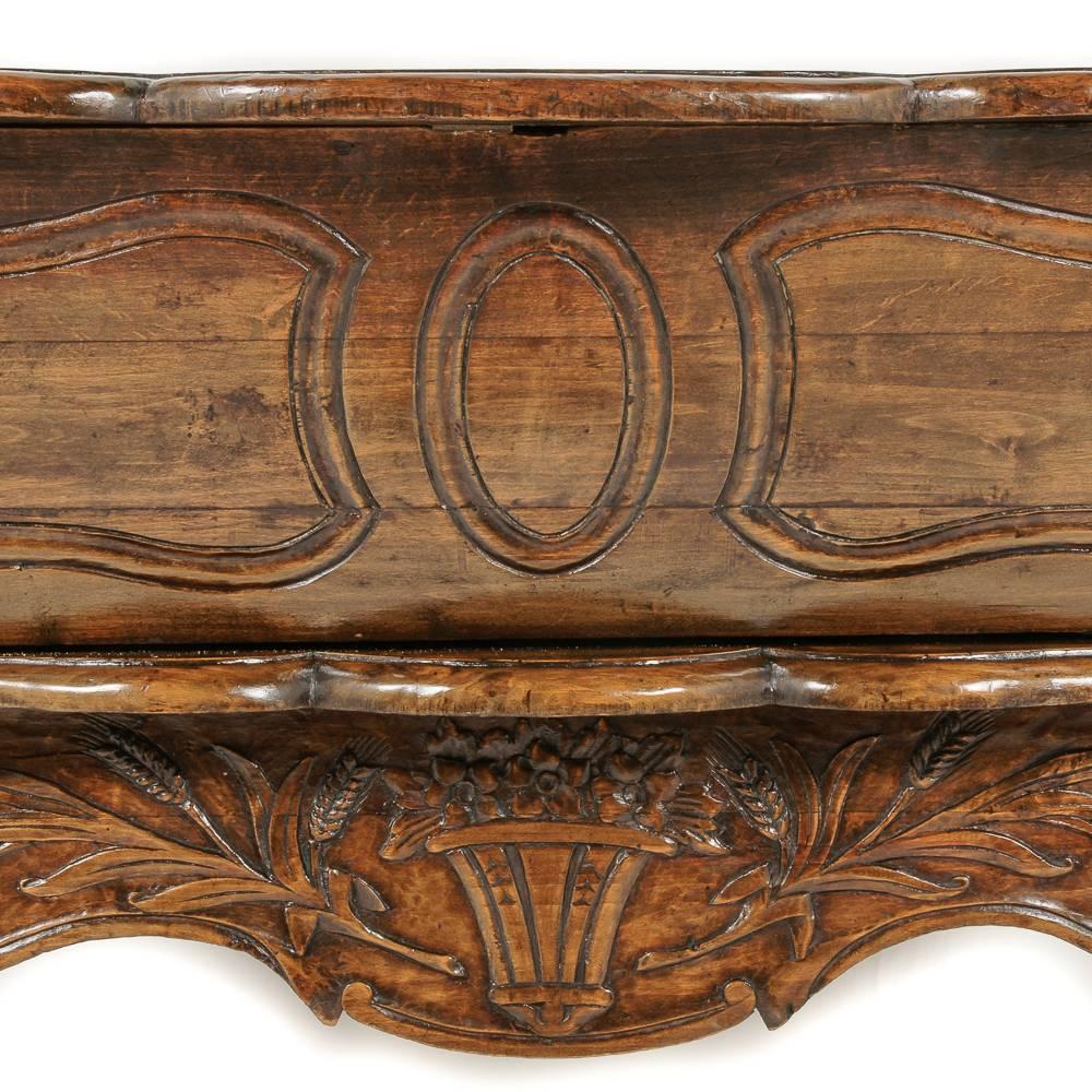 A French carved oak ‘maie’ or dough bin with hinged top and nicely-carved base, circa 1920.



       