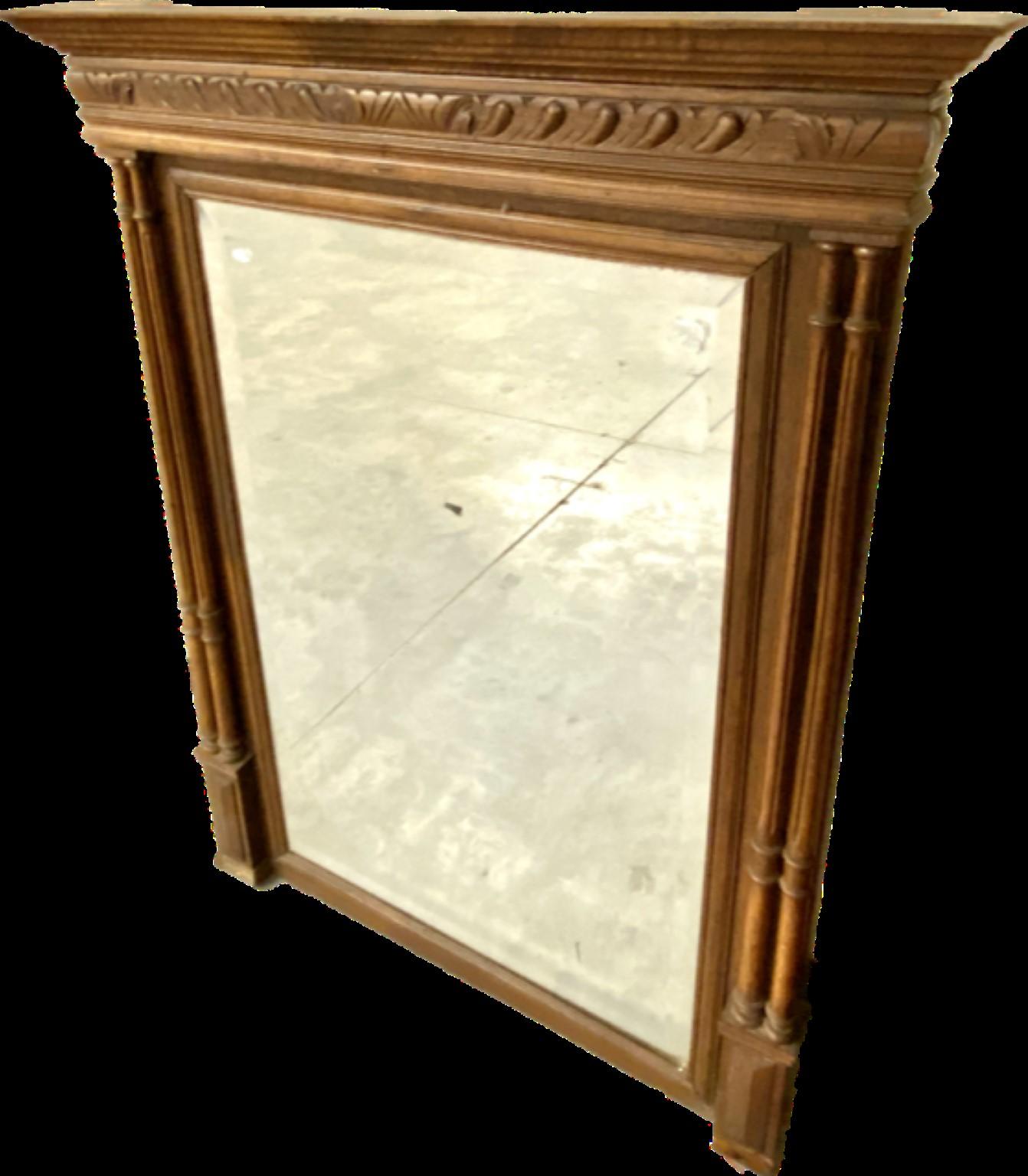 This mirror is a stately, French, carved oak, rectangular overmantel, with a heavy influence of symmetry in the Henry II renaissance style.