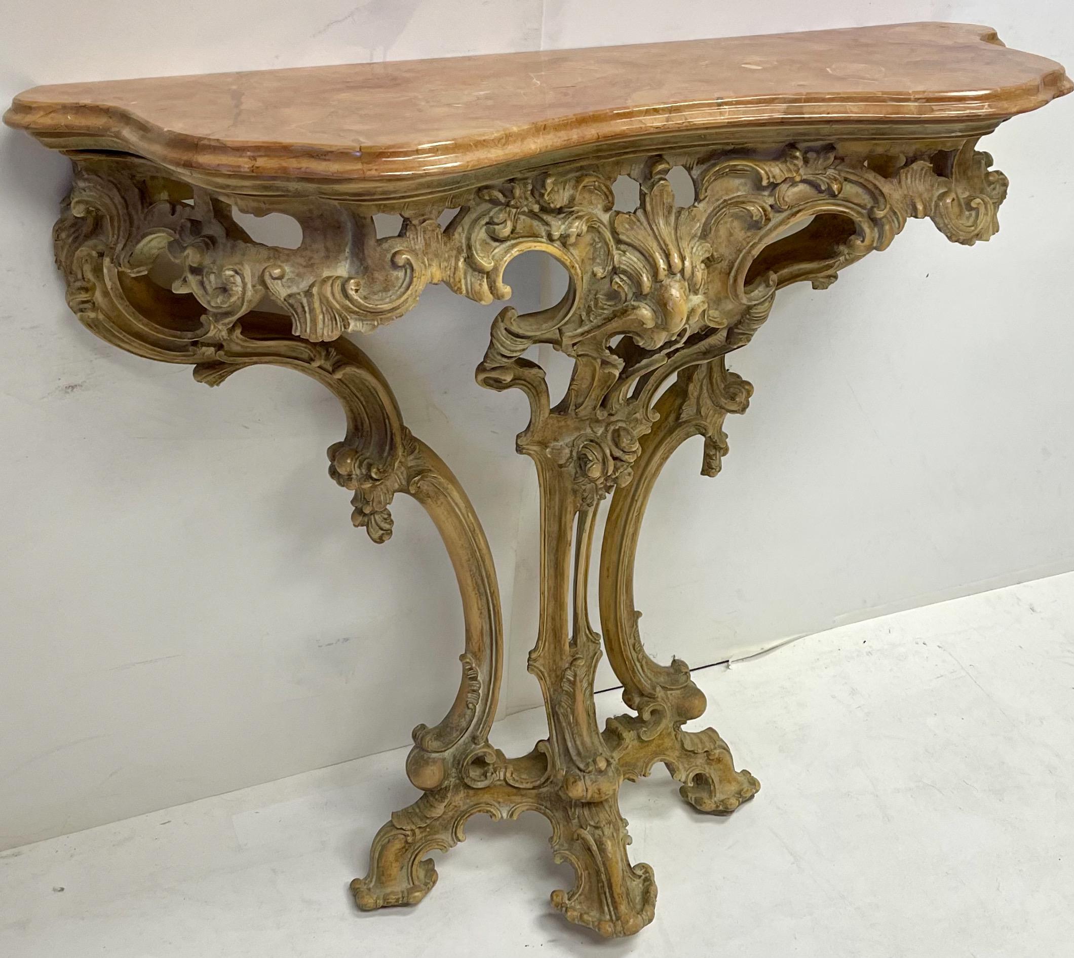 This is a French carved pine console table with rouge marble top. It is a wall mounted piece, and the marble is in good condition. It most likely dates to the 40’s /50’s.