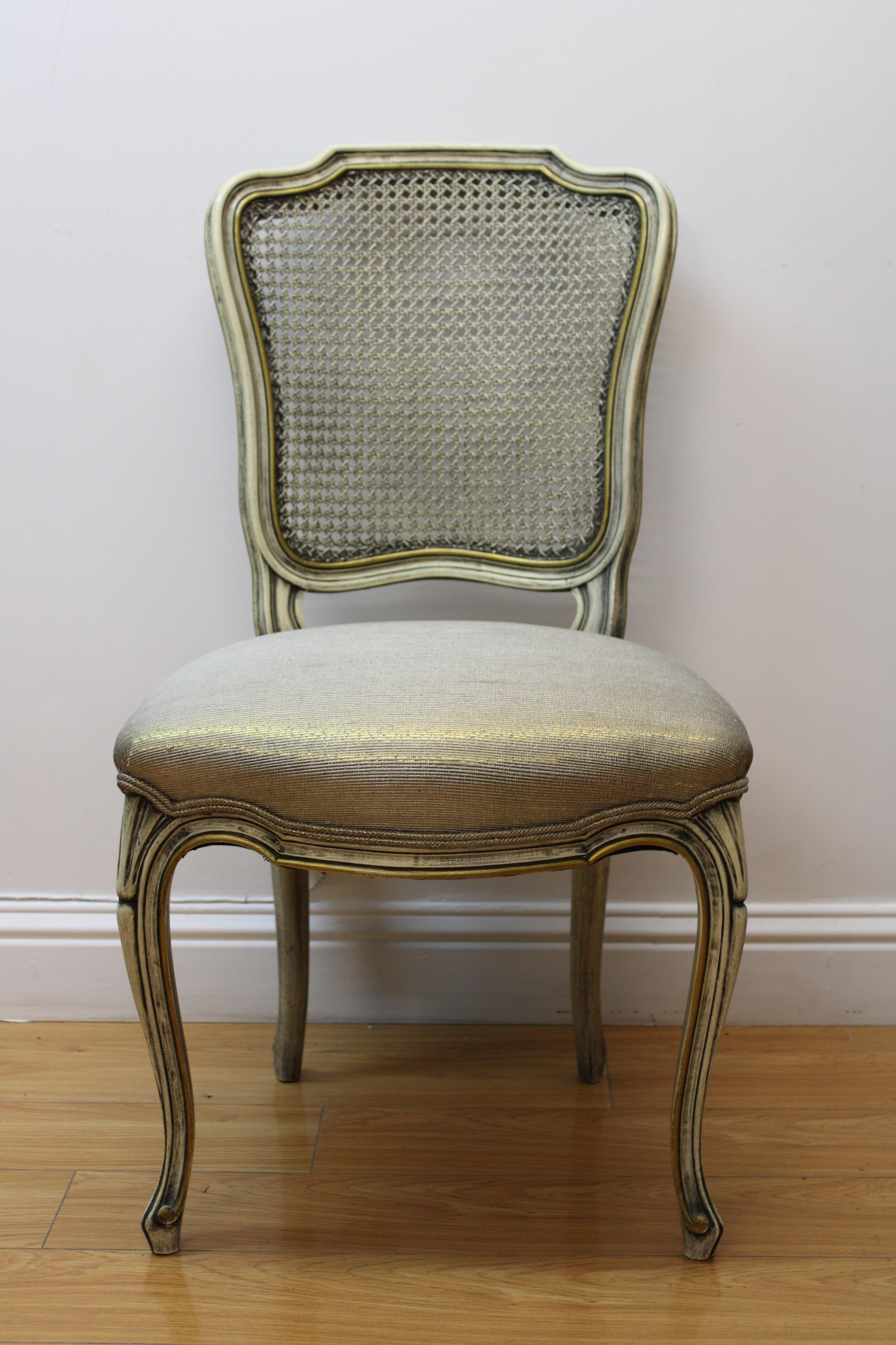 C. 20th Century

French carved side chairs w/ caned backs & upholstered seats. Hand painted in cream & gold.