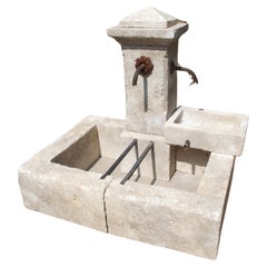 French Carved Single Pillar Limestone Fountain with Side Mounted Basin