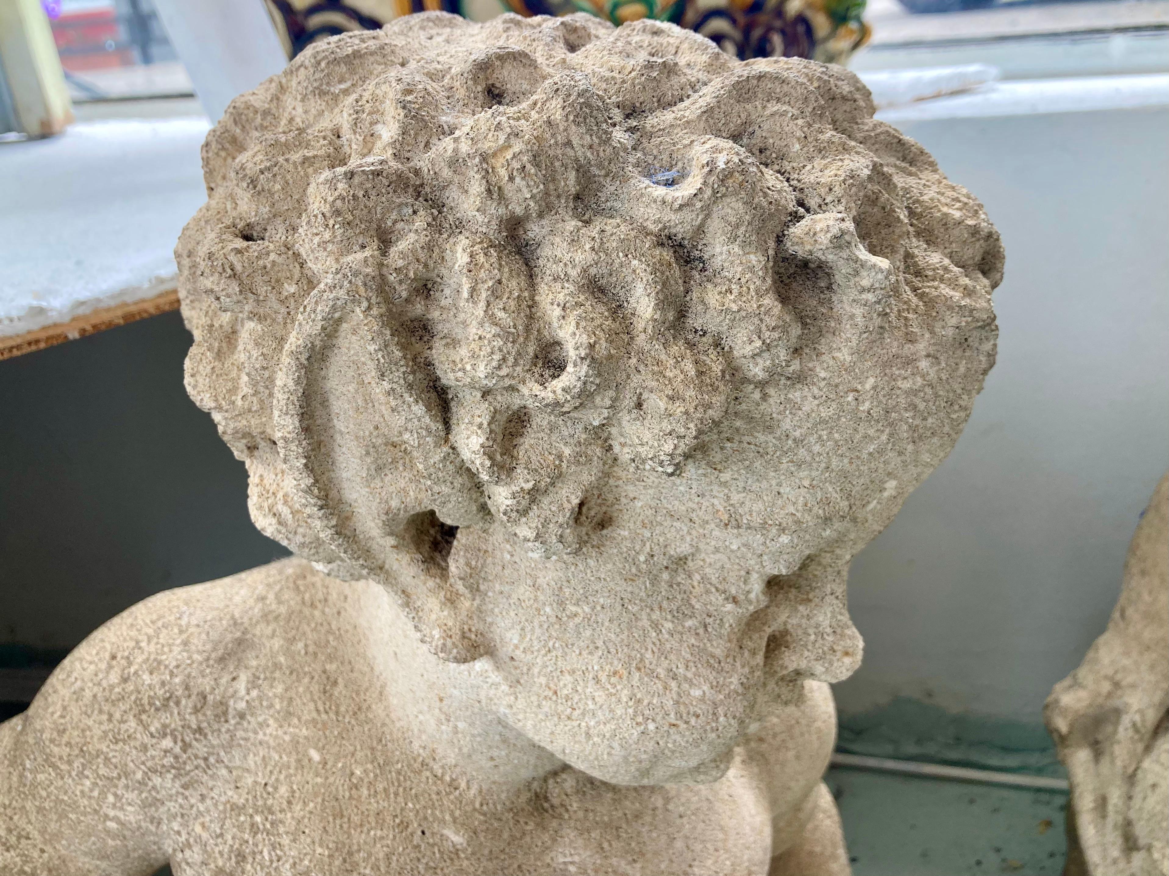 French Provincial French Carved Stone Putti and Pan Garden Statues, a Pair For Sale
