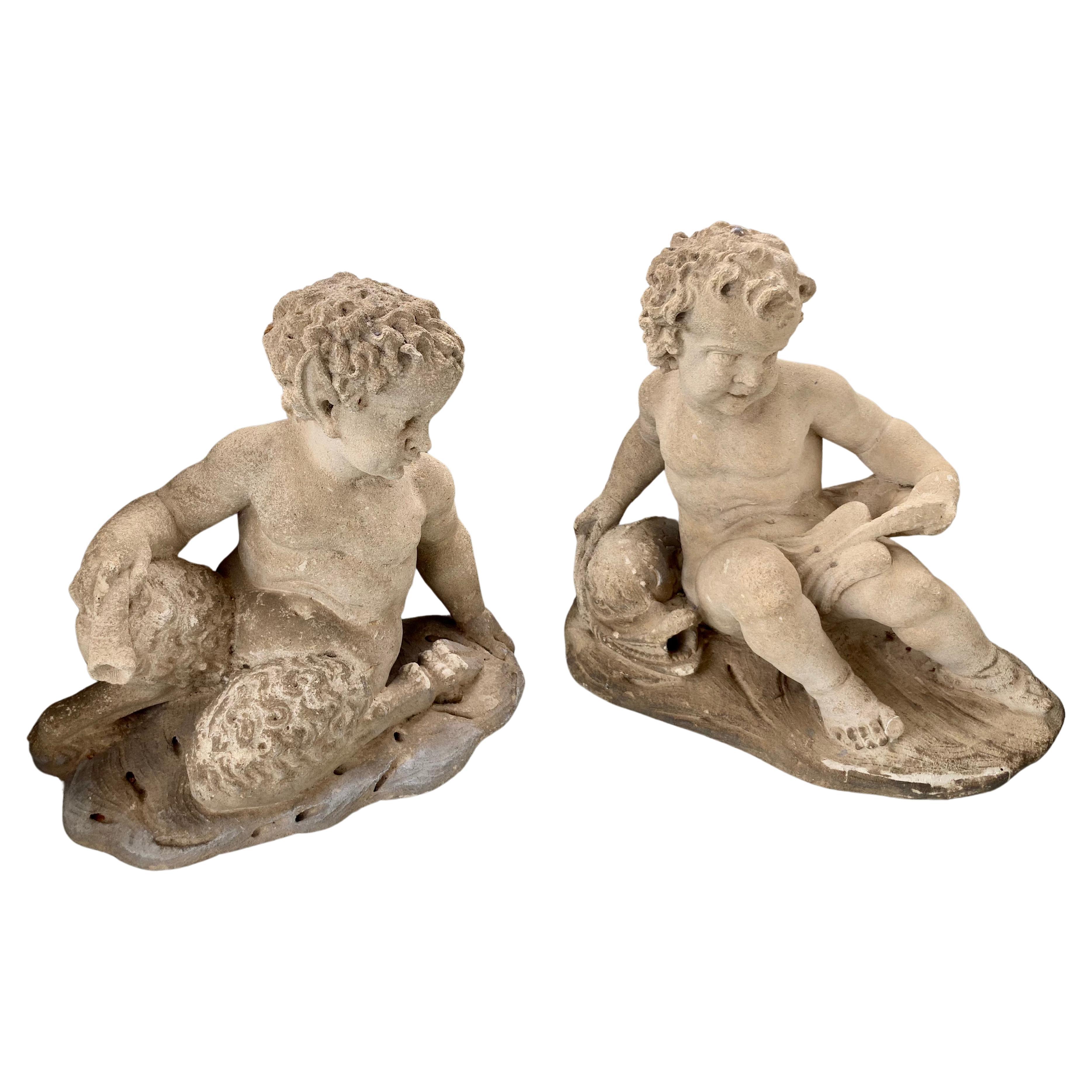 Paire de statues de jardin Putti et Pan en pierre sculptée française