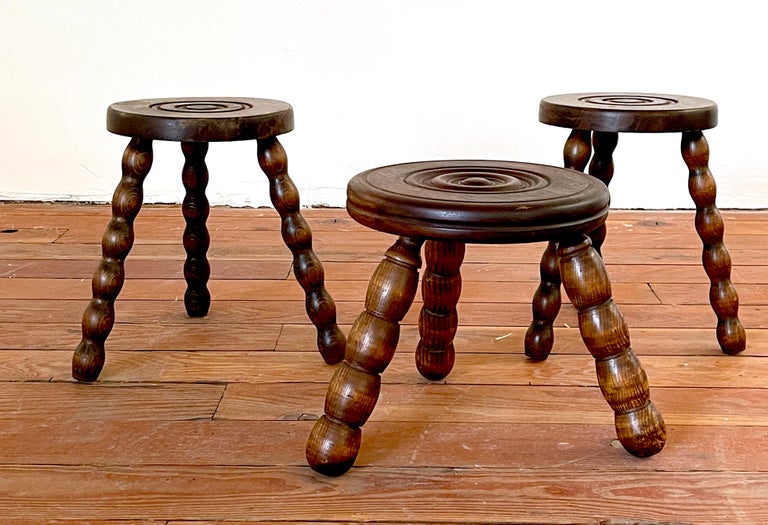 French oak stools with spiral carved legs and circular seat with concentric carved circles.
In the style of Charles Dudouyt.
Priced individually.

Stool 1 - 11