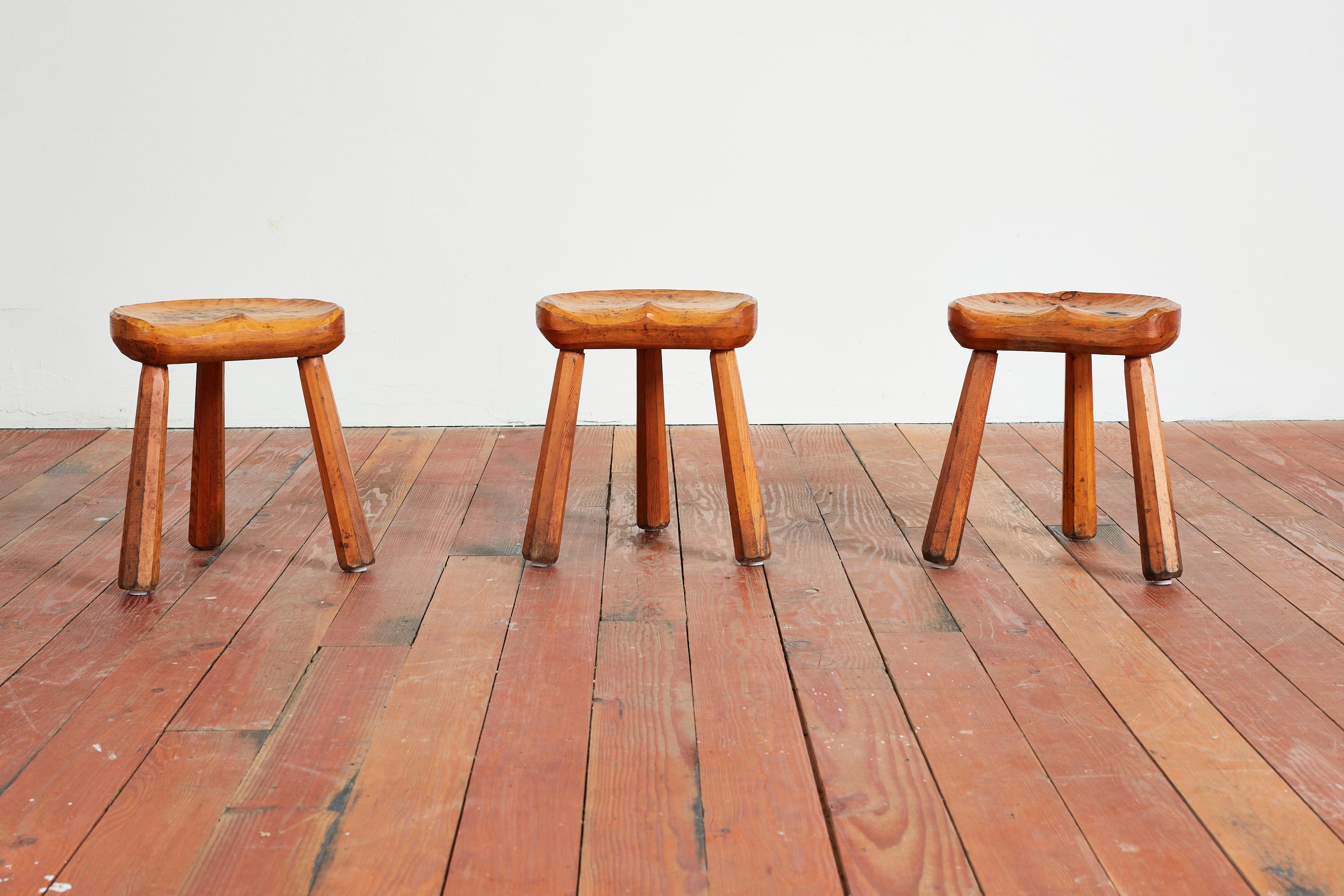Brutalist carved solid wood carved tripod stools
France, circa 1940s
Carved concave seats sit on tripod legs
Priced individually.