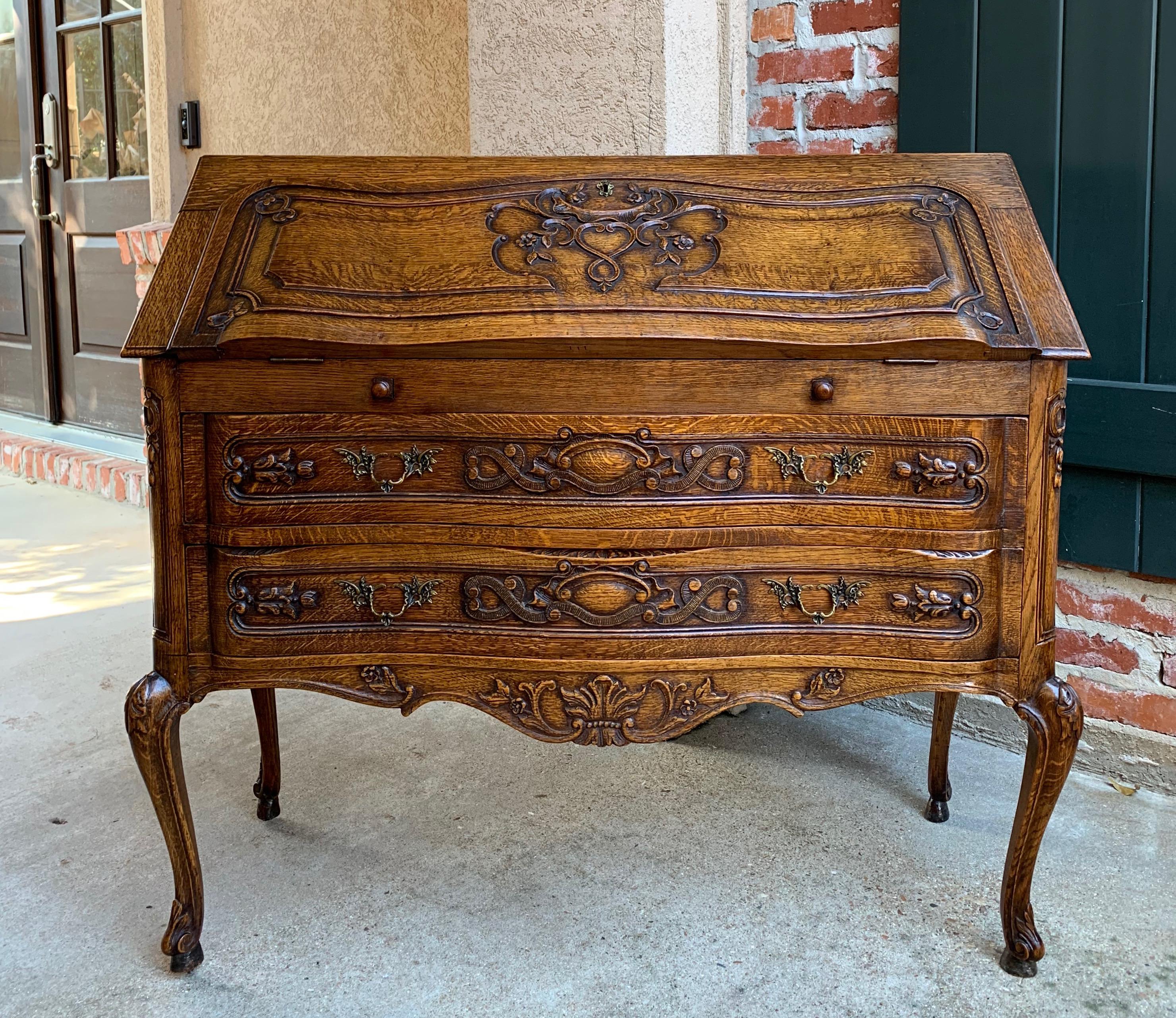 Direct from France, a lovely antique French carved “drop front” secretary/desk with quintessential French style from top to bottom!
~(NOTE this secretary is unique with it’s shaped front serpentine drawers, it is not ‘flat across the front’ like so