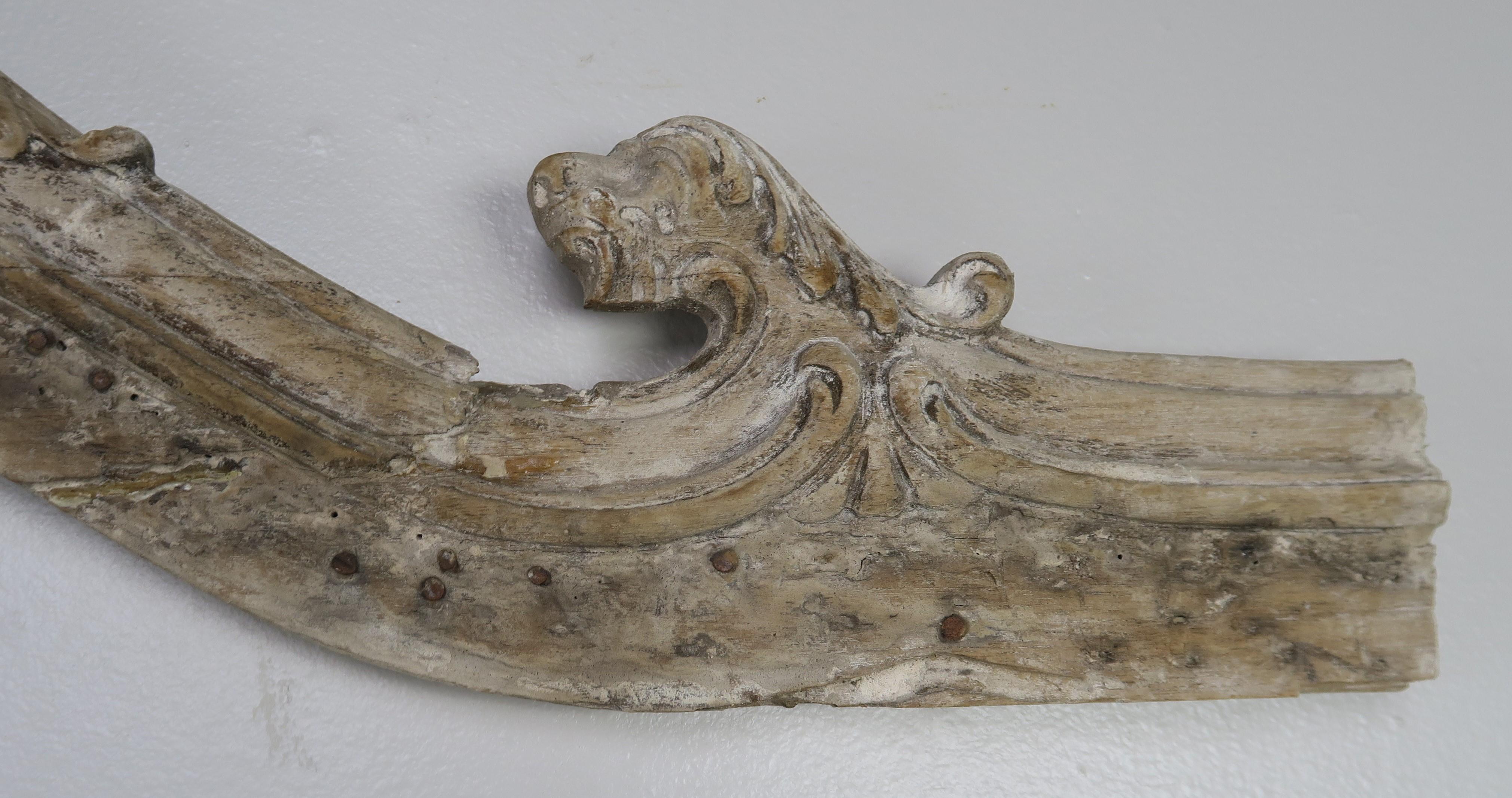 French carved bleached walnut architectural piece that would be great as an over door or it can be mounted on a Lucite base for decoration. Remnants of paint still seen throughout.