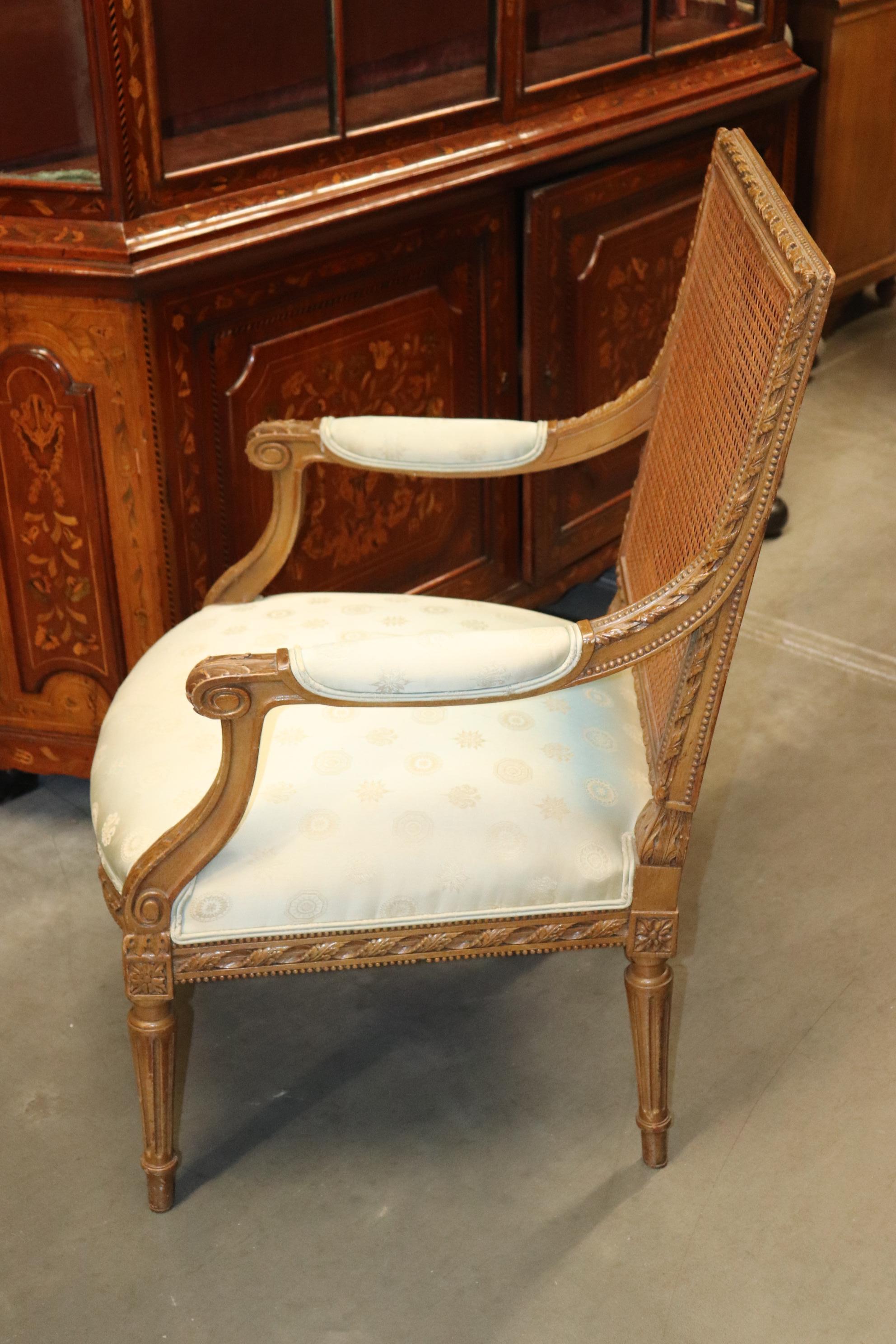 French Carved Walnut Cane Back Louis XVI Armchair Circa 1950 In Good Condition In Swedesboro, NJ