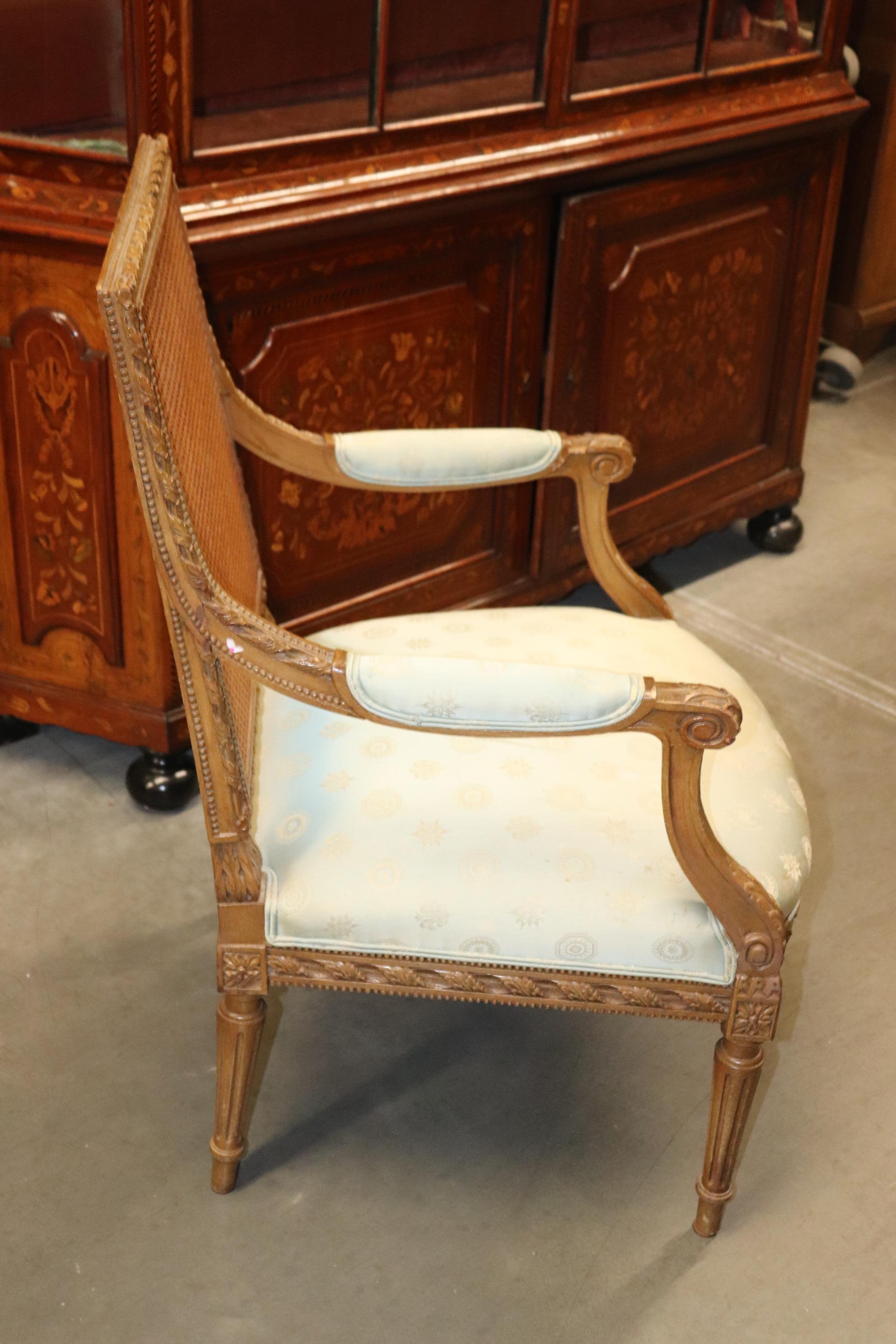 Mid-20th Century French Carved Walnut Cane Back Louis XVI Armchair Circa 1950