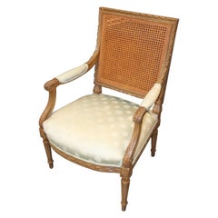French Carved Walnut Cane Back Louis XVI Armchair Circa 1950