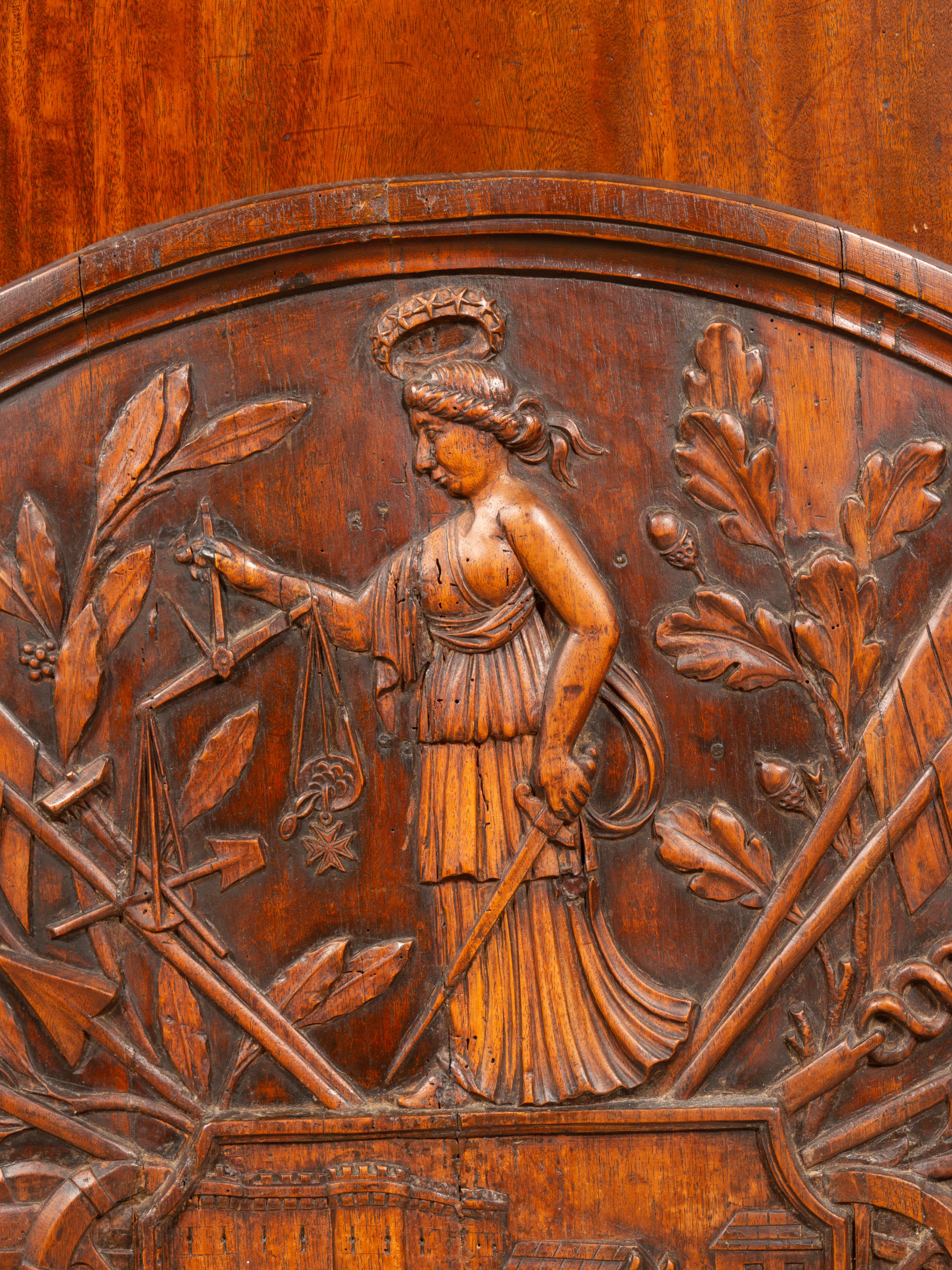 Possibly made to be used as a model or mold to cast an iron fireback. Depicting the Bastille and a woman with the sword and the scales. Also cannons, flags, cannon balls.