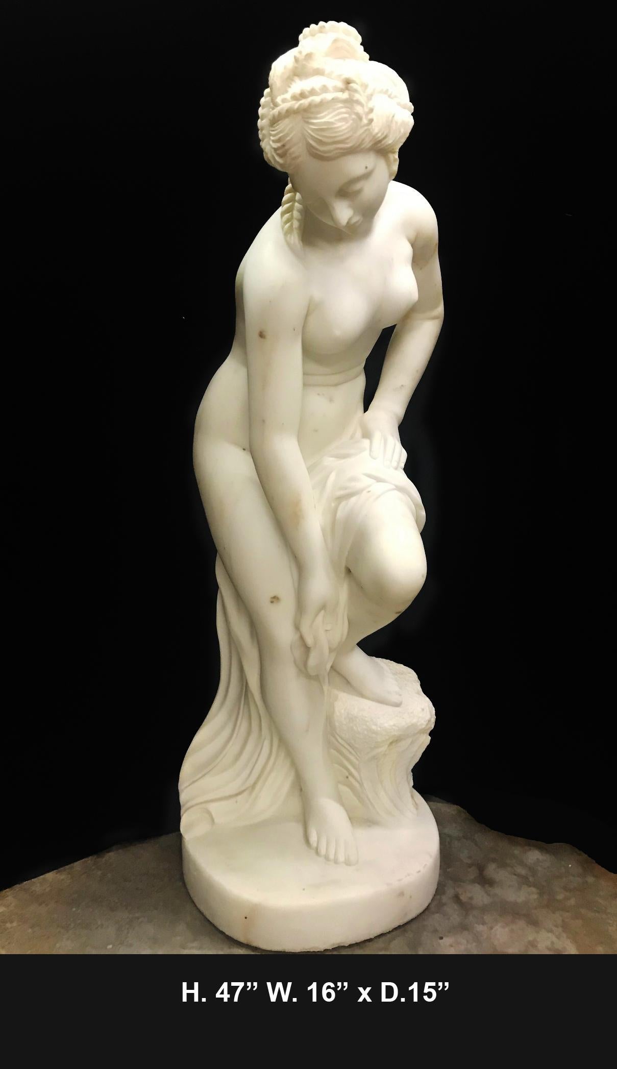 Lovely French finely carved white marble figure of Nude Diana after bath,
mid-20th century. 

Nude Diana is leaning near a tree stump, her hair tied with a string of pearls, raised on oval marble plinth. Meticulous attention was given to the
