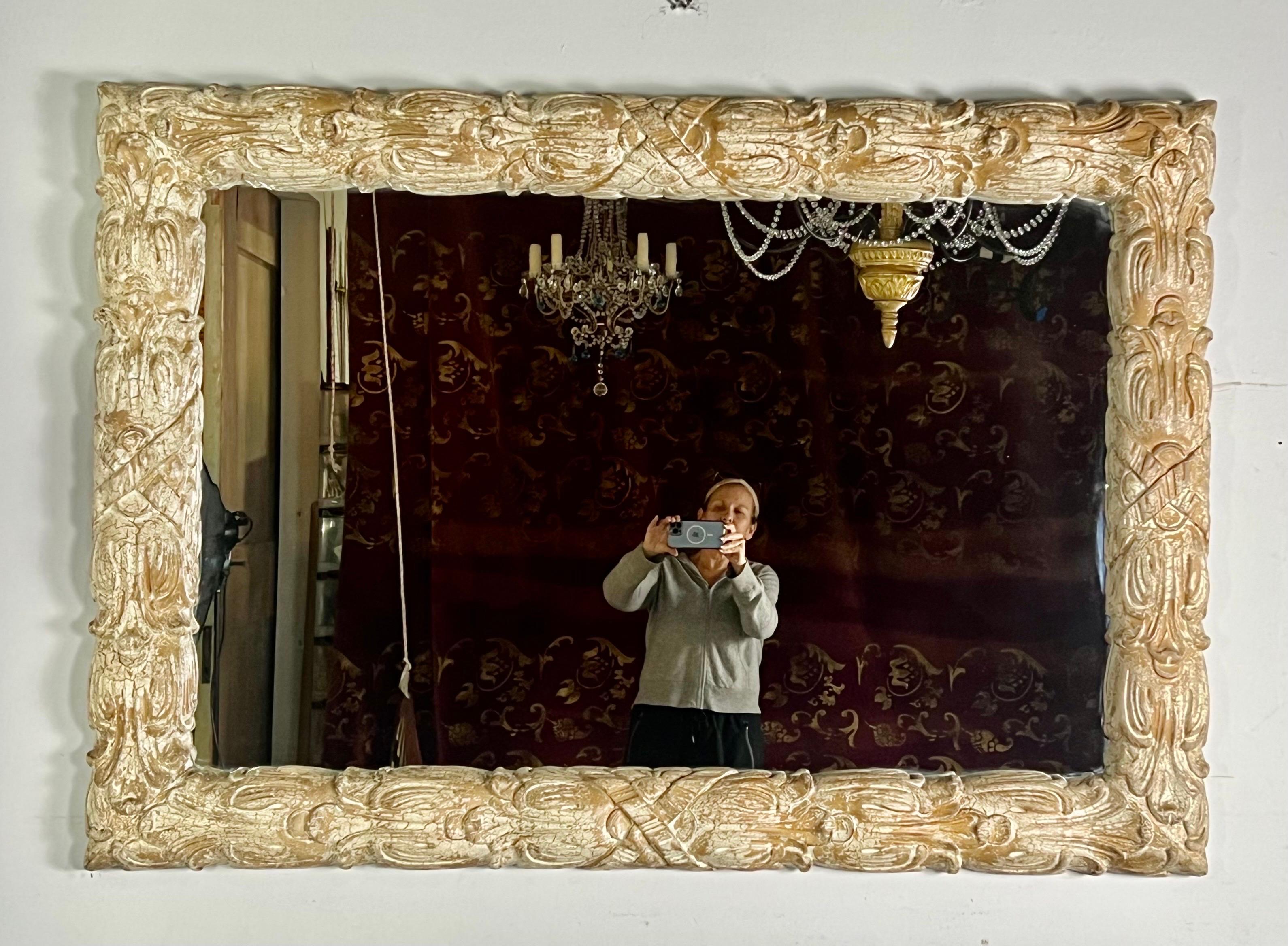 Grand scale French style rectangular shaped mirror that can be installed vertically or horizontally. It has a custom painted crackle finish in a creamy oatmeal color that was popular in the Mid-20th Century.