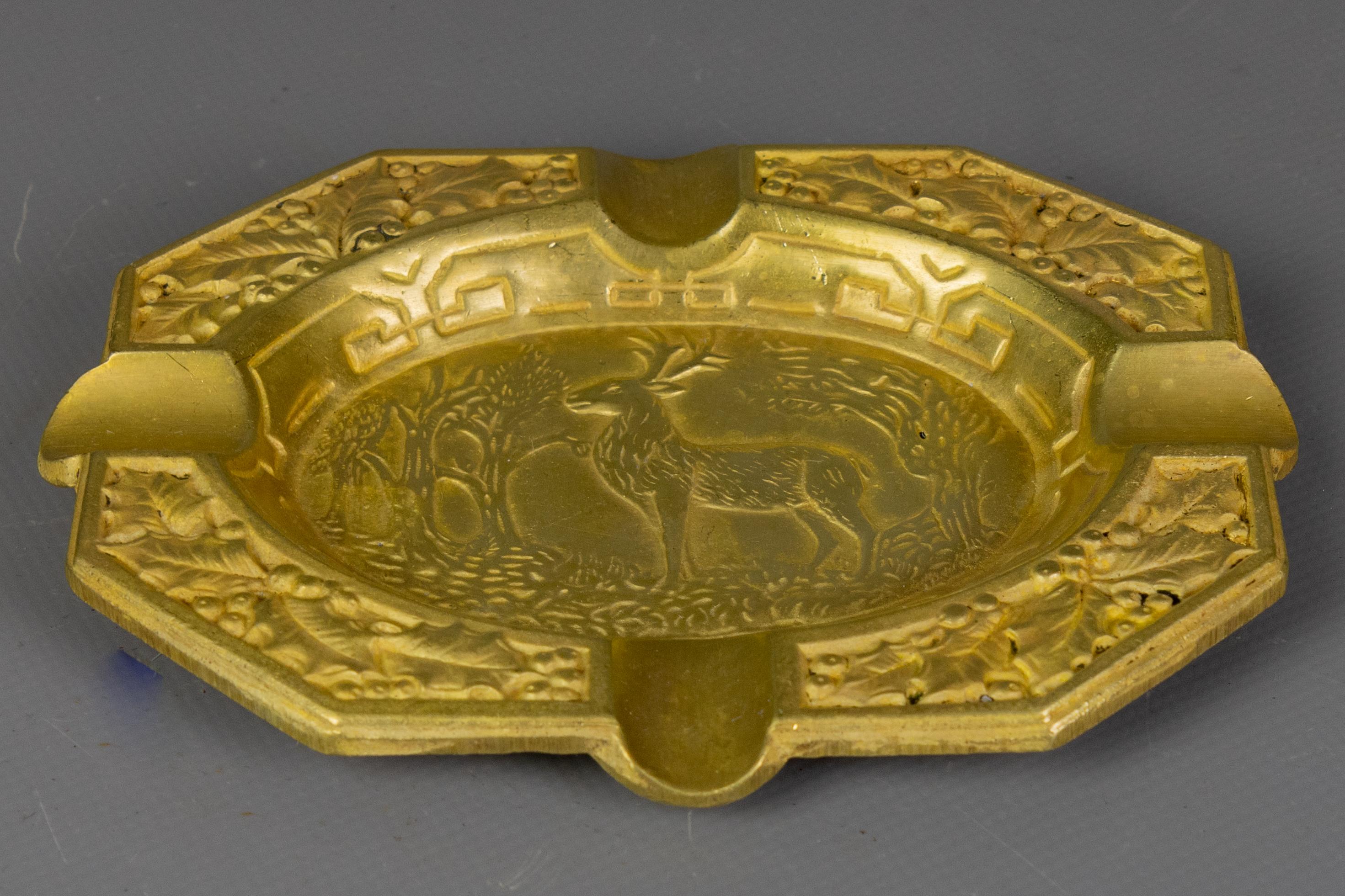 Mid-century French bronze ashtray featuring a relief stag and foliage design.

A finely cast French bronze ashtray from the 1950s, showcasing a beautifully detailed relief of a stag in a forest landscape. The octagonal shape is accented with raised