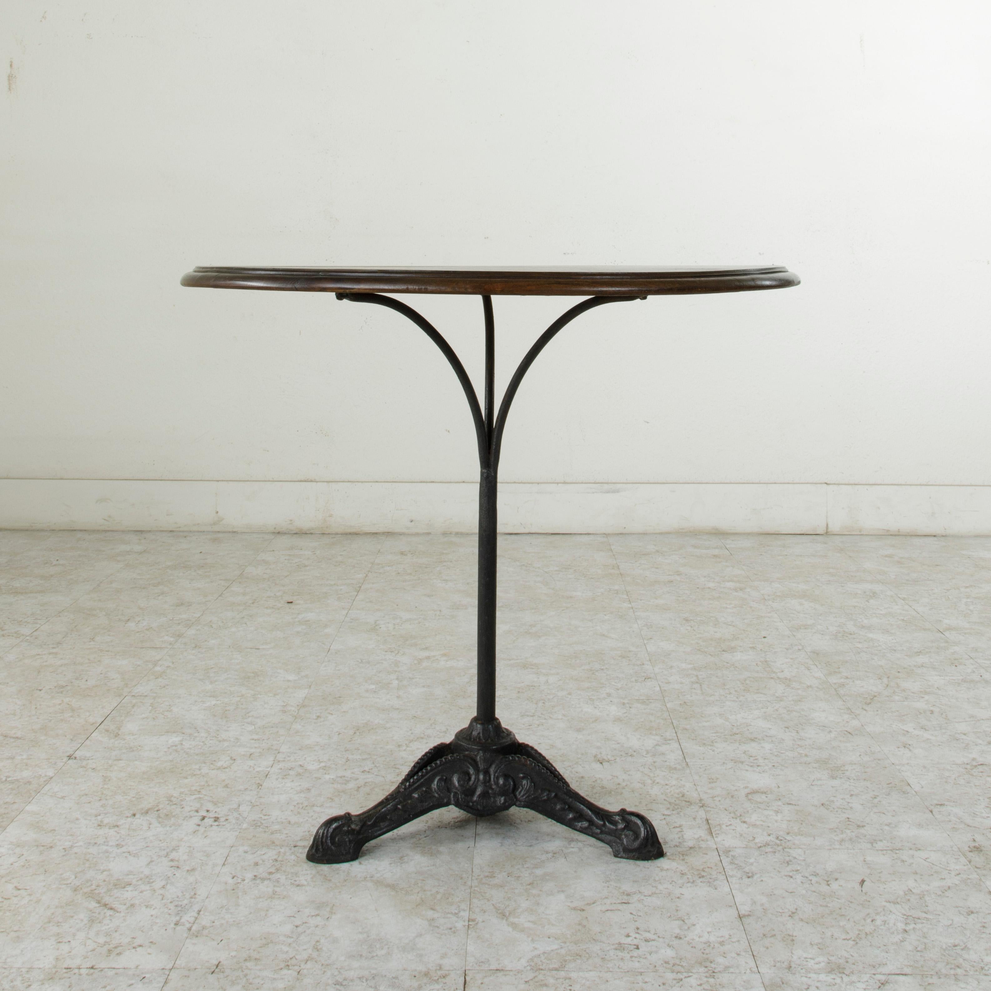 Early 20th Century French Cast Iron Bistro Table or Cafe Table with Round Walnut Top, circa 1900