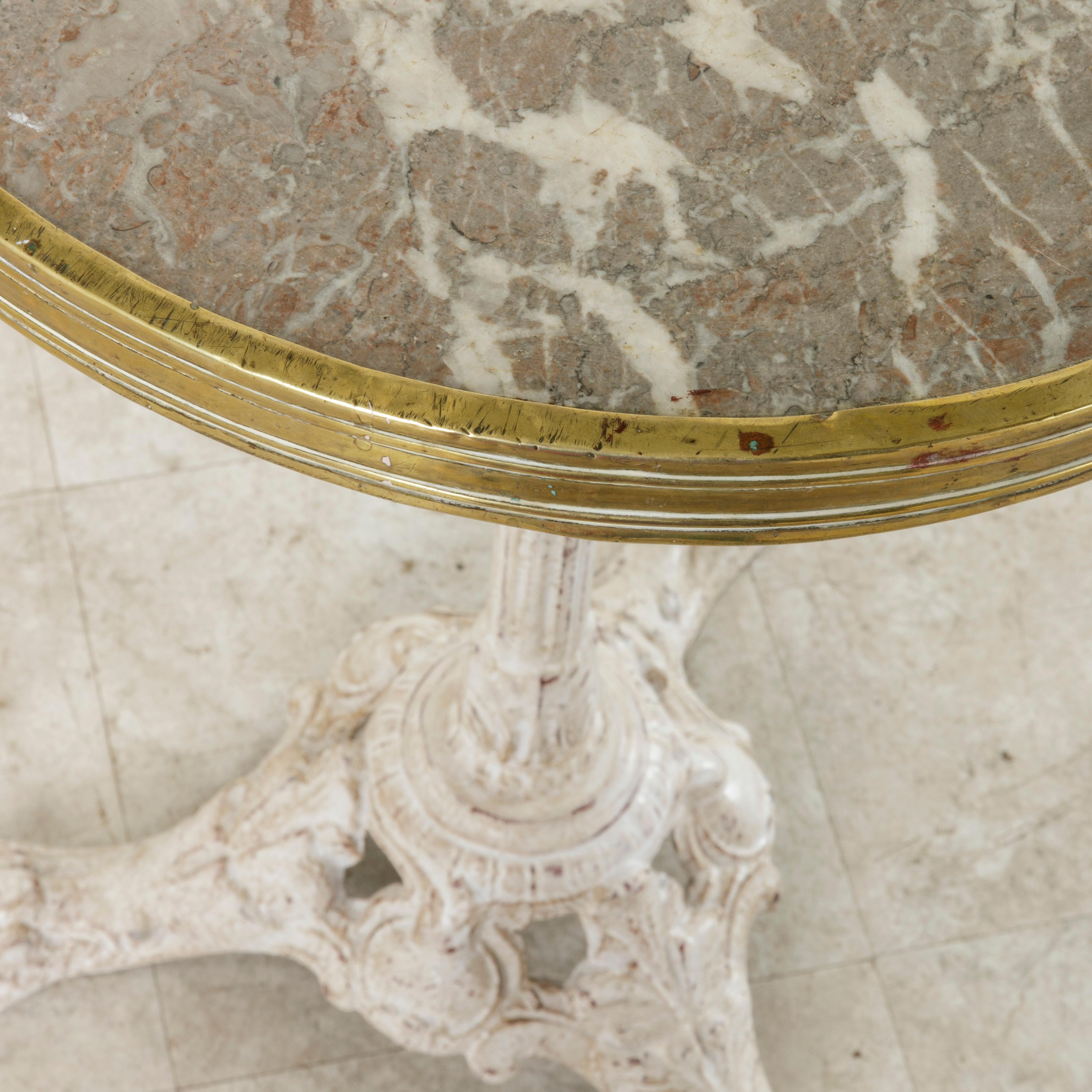 Early 20th Century French Cast Iron Bistro Table with Marble Top and Brass Rim, circa 1900