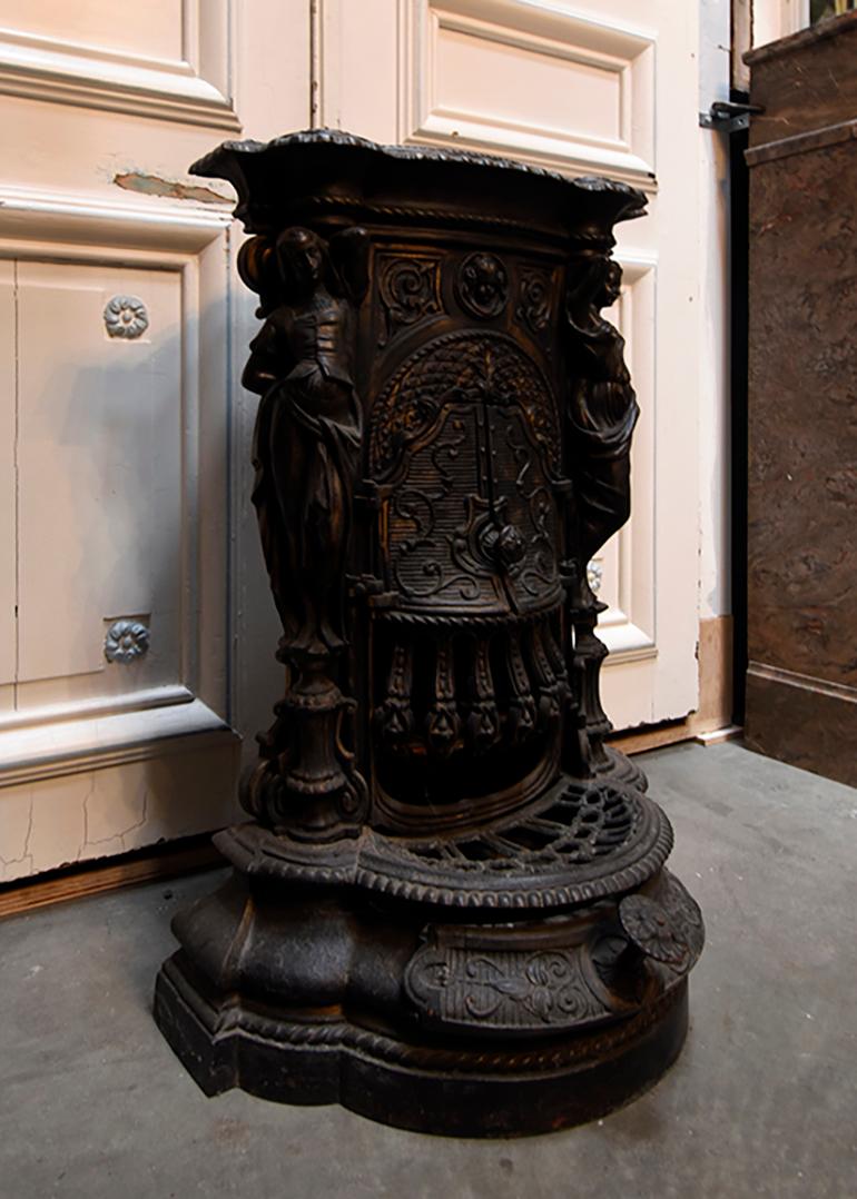 Antique cast iron blue black heater tower stove.
It contains a heavy cast iron construction.