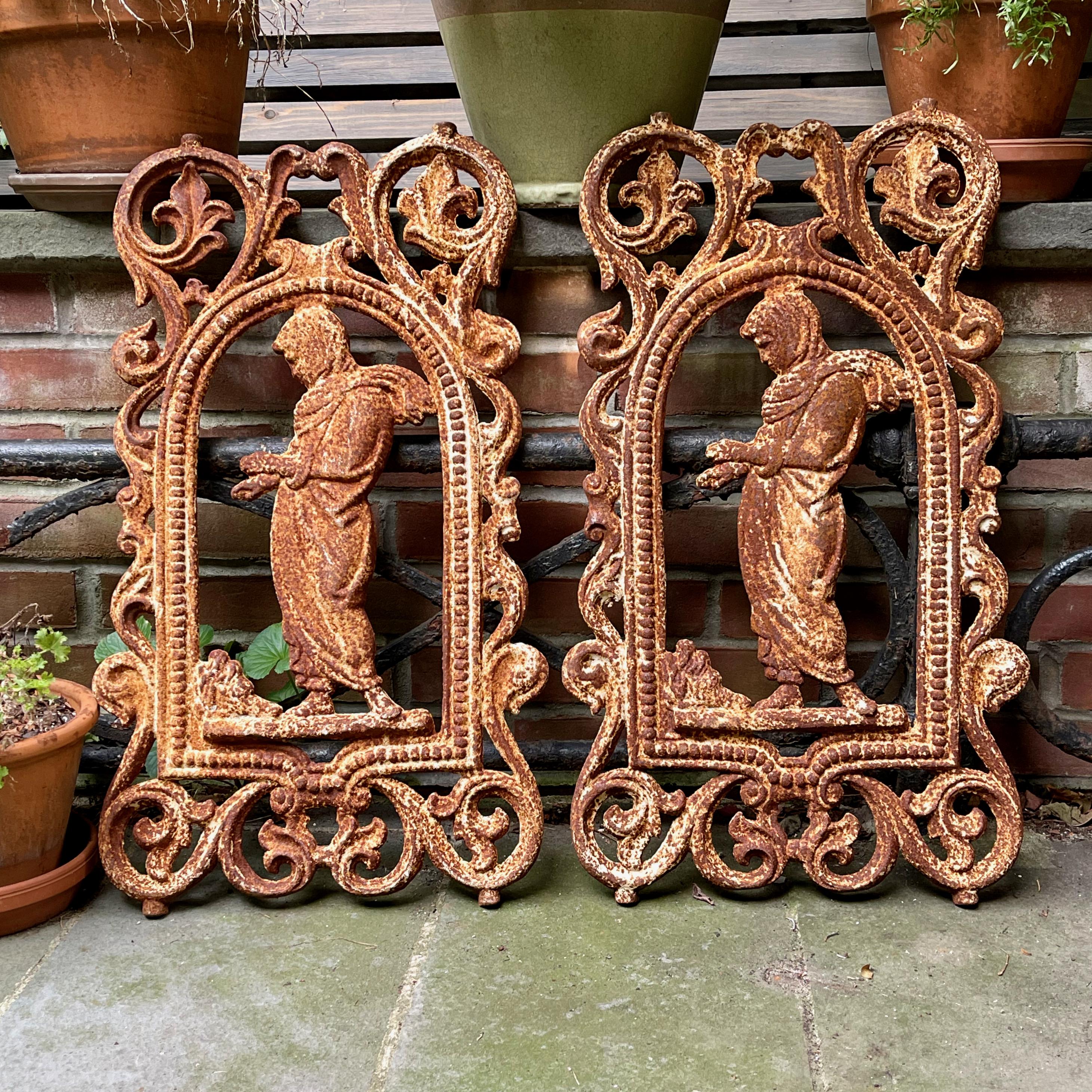 A cast iron flatback panel originally from a balcony rail in France.

Dating to the mid-late 19th century, these decorative objects were used as building or garden elements.
Heavy, weighing about 25 pounds, and aged with a beautiful patina, the