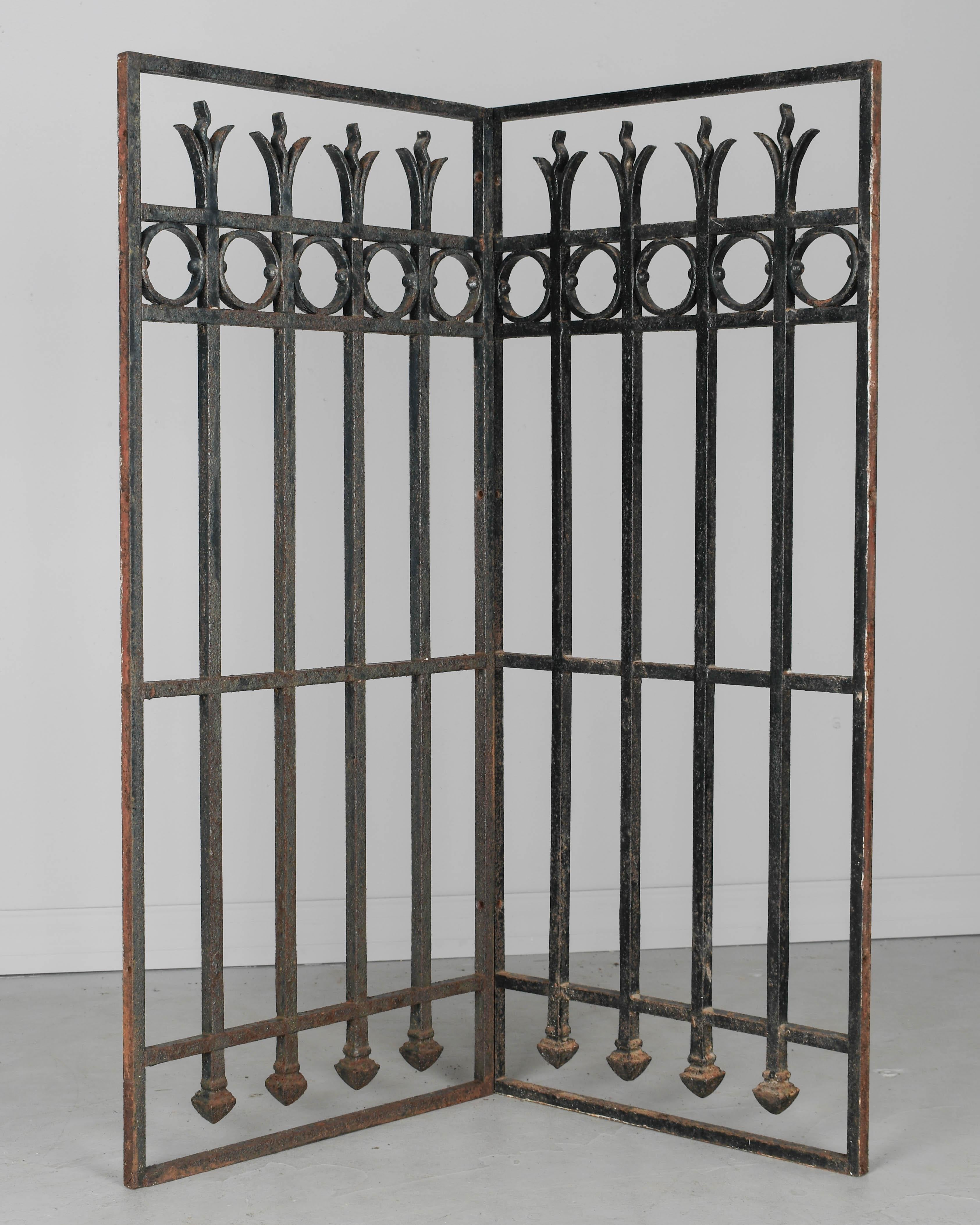 A pair of 19th century French cast iron architectural grilles or decorative panels. Black painted patina with some rust and minor paint loss. Good quality iron work. Please refer to photos for more details. Pictures are part of the description.