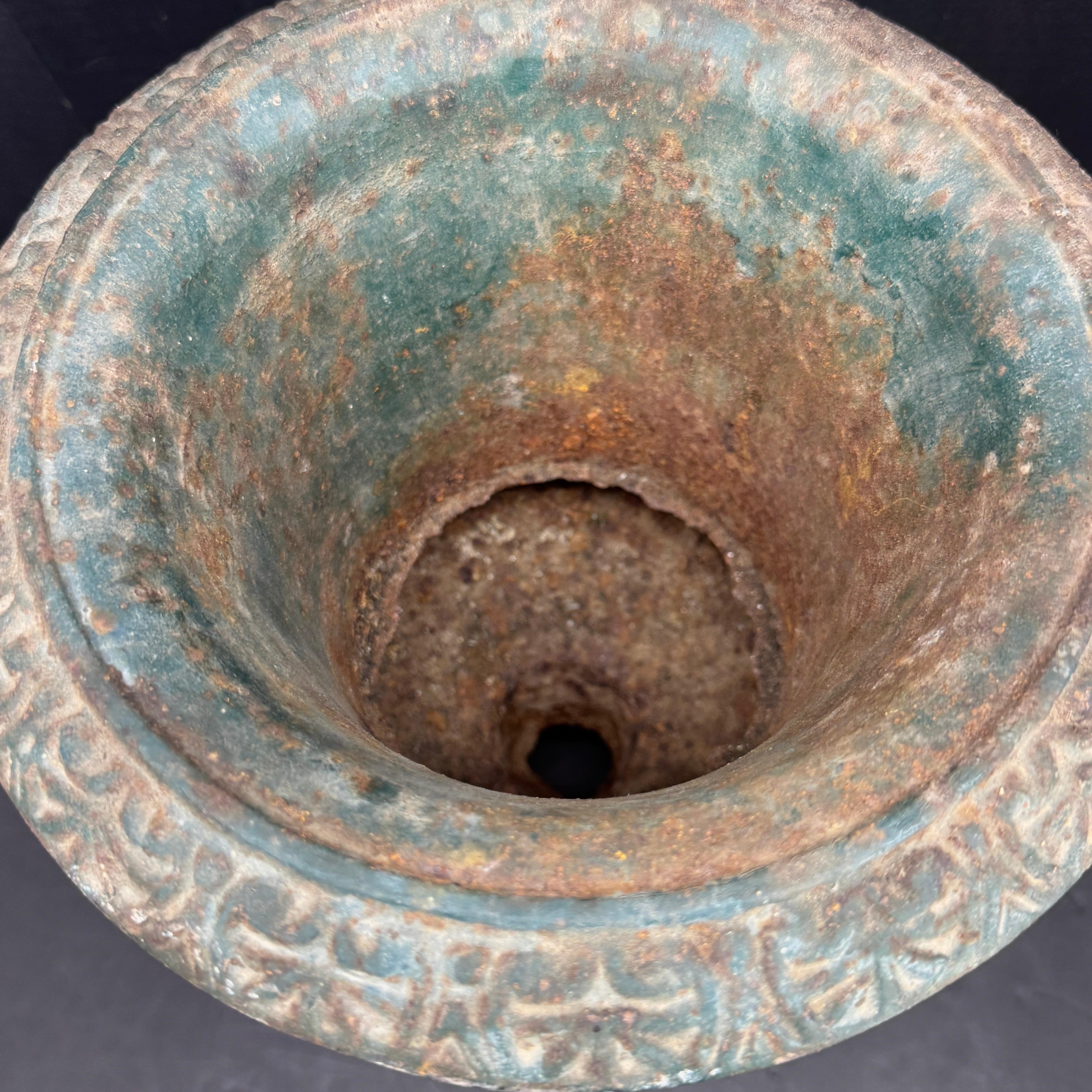 Small Cast Iron Classic Urn Planter, France. Exceptional and substantial in its own right, this cast iron piece featuring amazing original patina. Its timeless design lends itself perfectly to enhancing garden spaces, porches, or entryways, whether