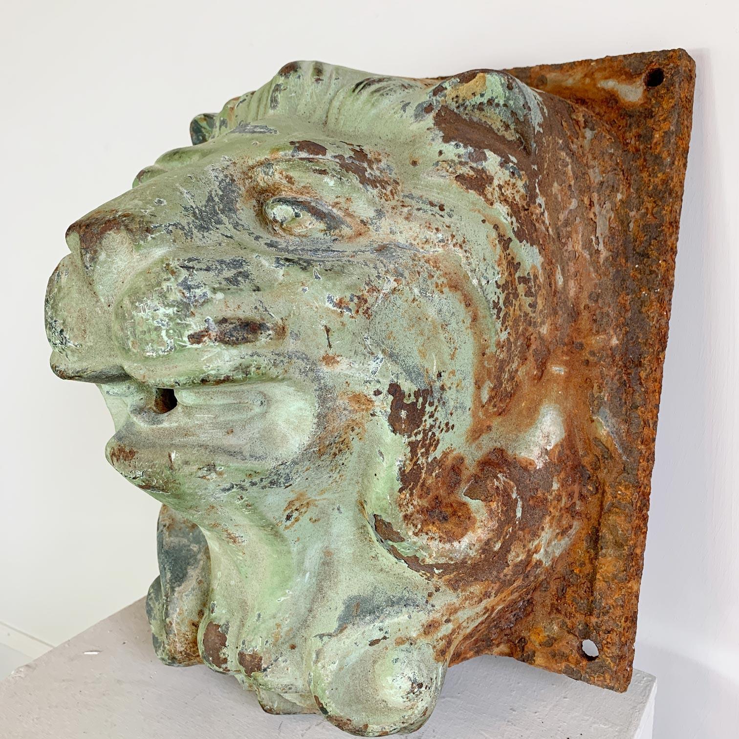 Dating to the latter 19th century this cast iron French wall mounted water feature is wonderfully detailed, the green paint, aged over the decades is sublime. All four fixing points are present and in good order

Measures: Height 29.5cm, Width