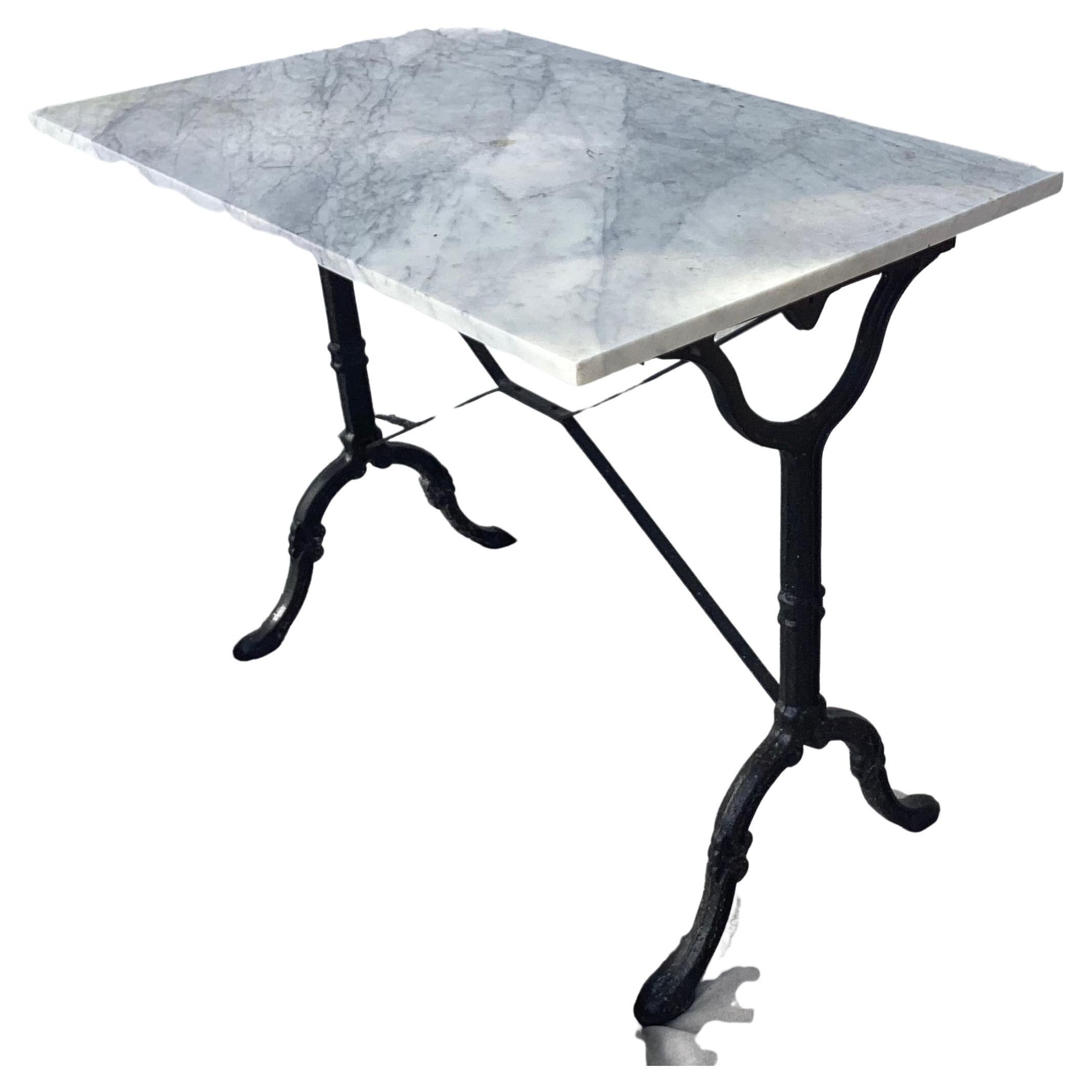French cast iron marble top bistro table with beautiful black white and gray marble top. Nice patina. Perfect for indoor or outdoor use. Beautiful solid and sturdy.