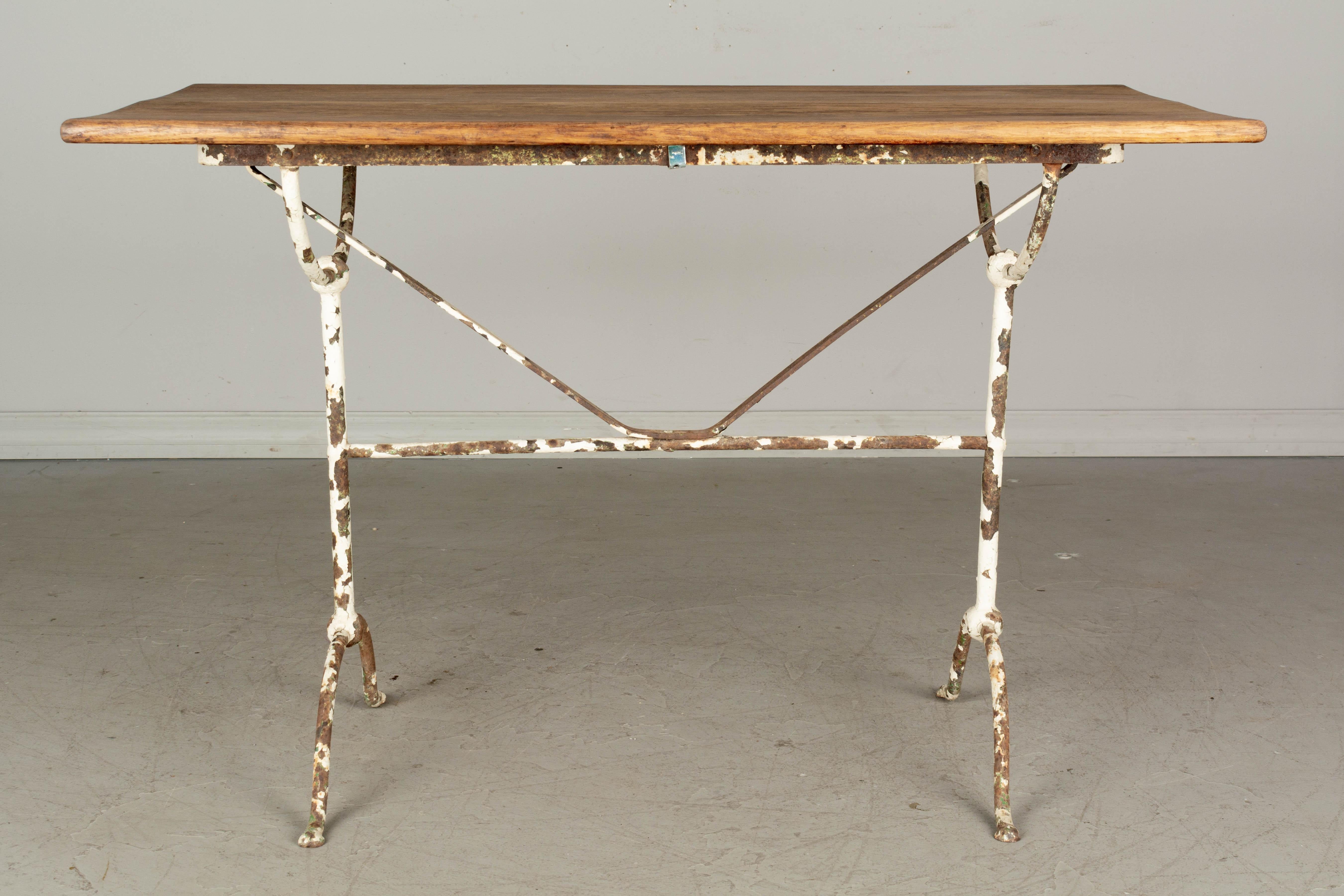 19th Century French Cast Iron Oak Top Bistro Table For Sale