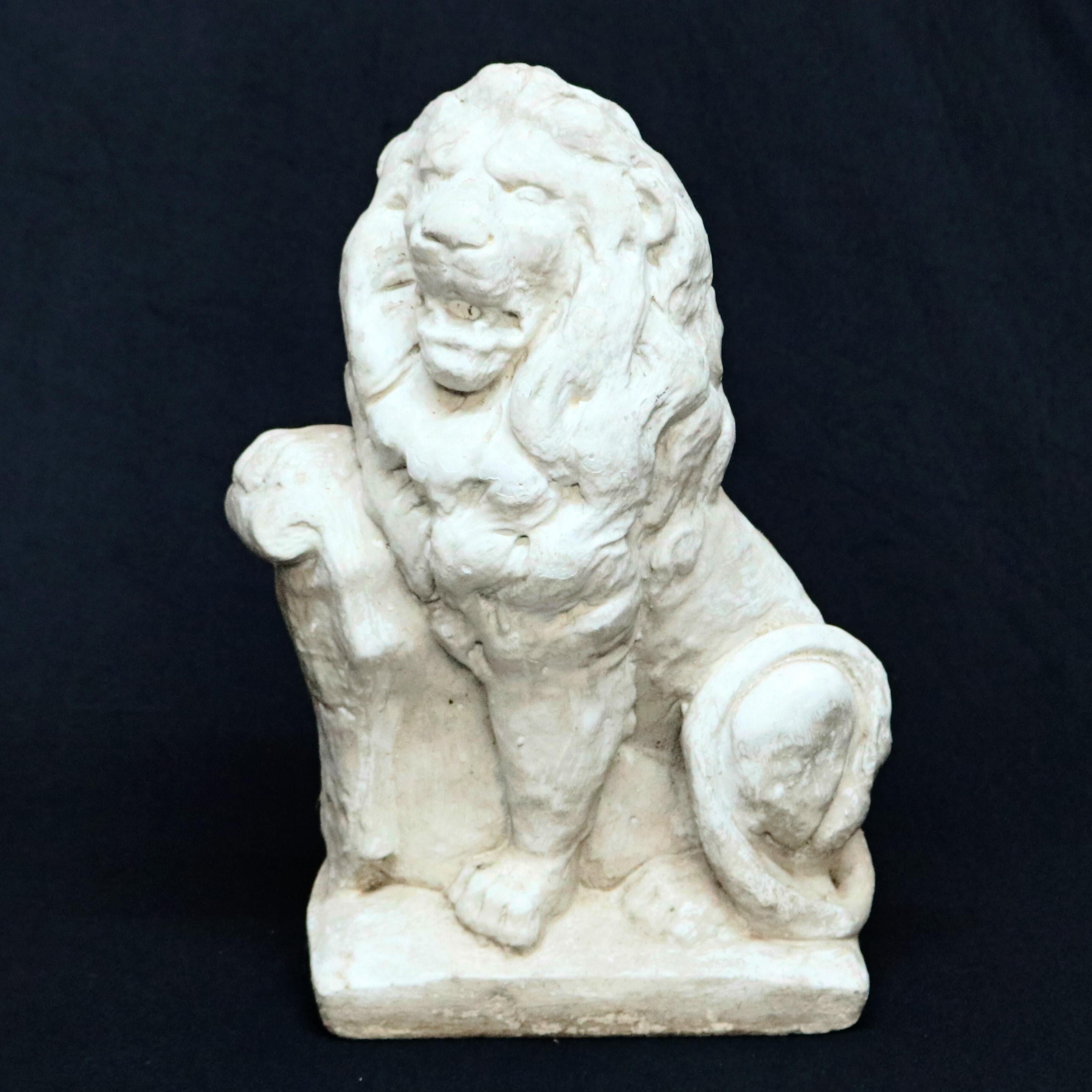 A French figural garden sculpture offers cast stone construction and depicts seated guardian lion with shield, circa 1940


Measures: 19.5