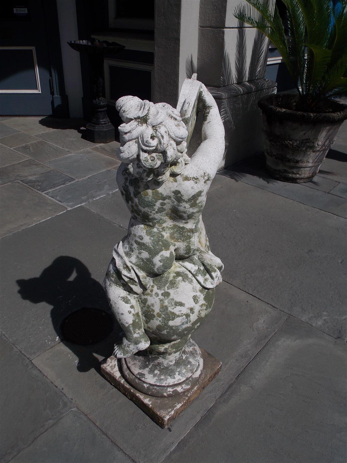 French Cast Stone Musical Putti Garden Ornament Seated on Sphere Plinth, C. 1840 In Excellent Condition For Sale In Hollywood, SC