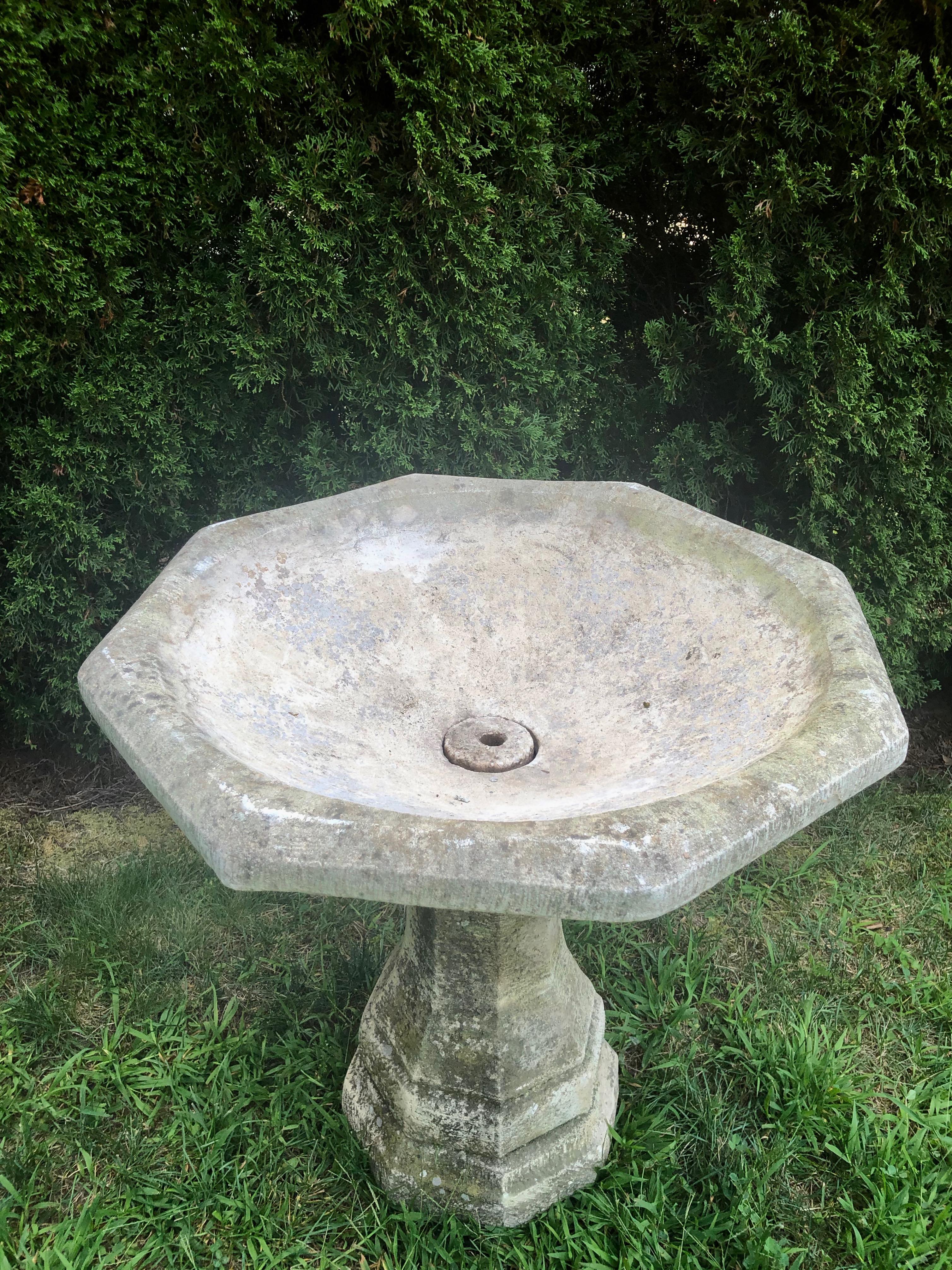 This lovely French cast stone piece has enormous versatility, as it can be used as a birdbath, a fountain, or a planter. With lovely weathering and an outstanding form, it is in perfect condition and is large enough to serve as a focal point in a