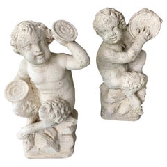 Vintage French Cast Stone Pan and Putti Musician Sculptures, a Pair