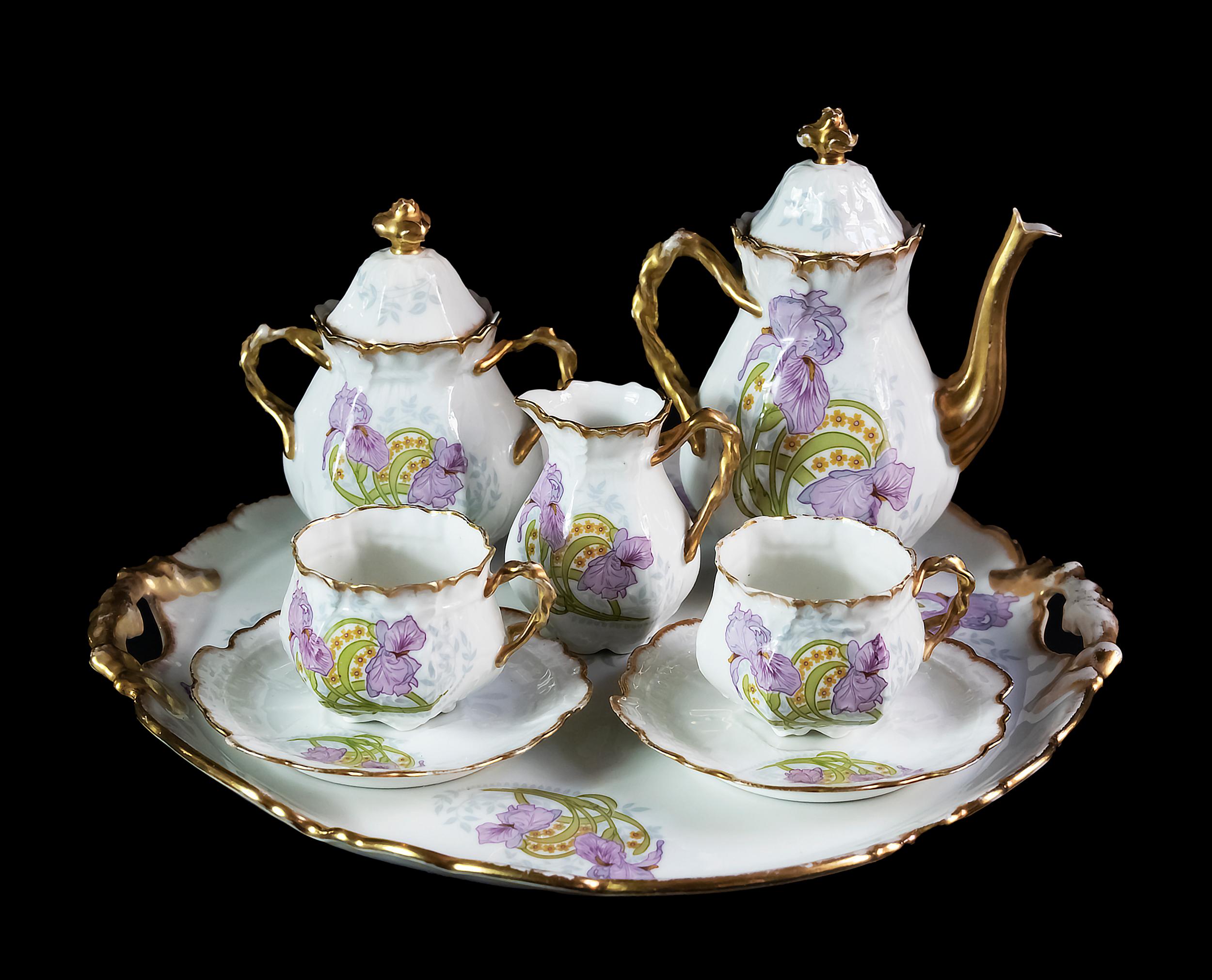 French porcelain coffee set for 2 persons.
Including coffee pot, milk jug, sugar bowl, round tray and 2 cups with saucers.
Porcelain is hand crafted with iris flower decor.
Dimensions: coffee pot: H 18 cm, milk jug H 9 cm, sugar bowl H 14 cm, round