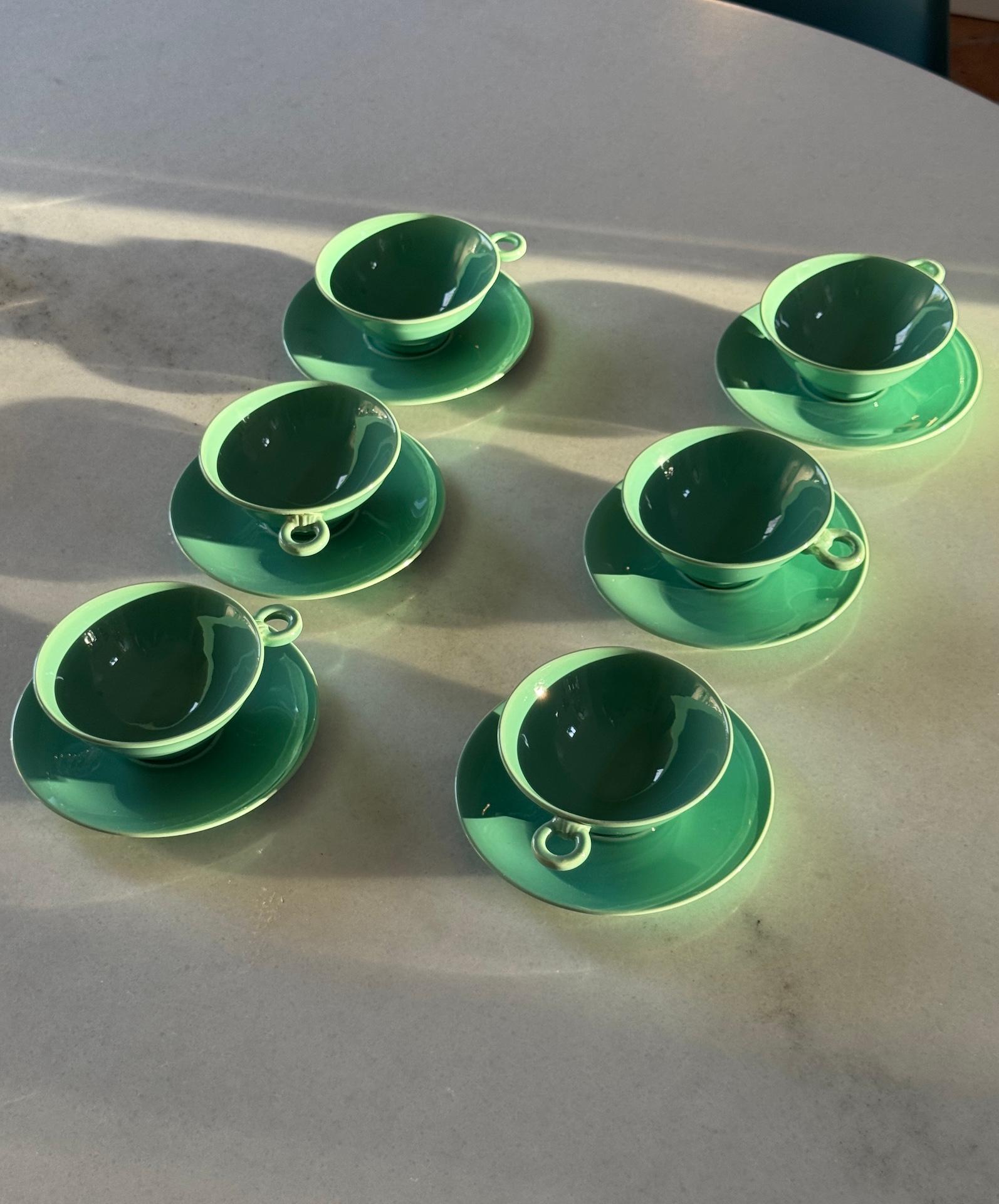 French Art Deco Tea and Coffee Set by Marcel Goupy Rouard for 12 people.
This earthenware set has this irresistible Celadon colour. The shapes are beautifully rounded, soft and rendering this material particularly well. Marcel Goupy shows here his