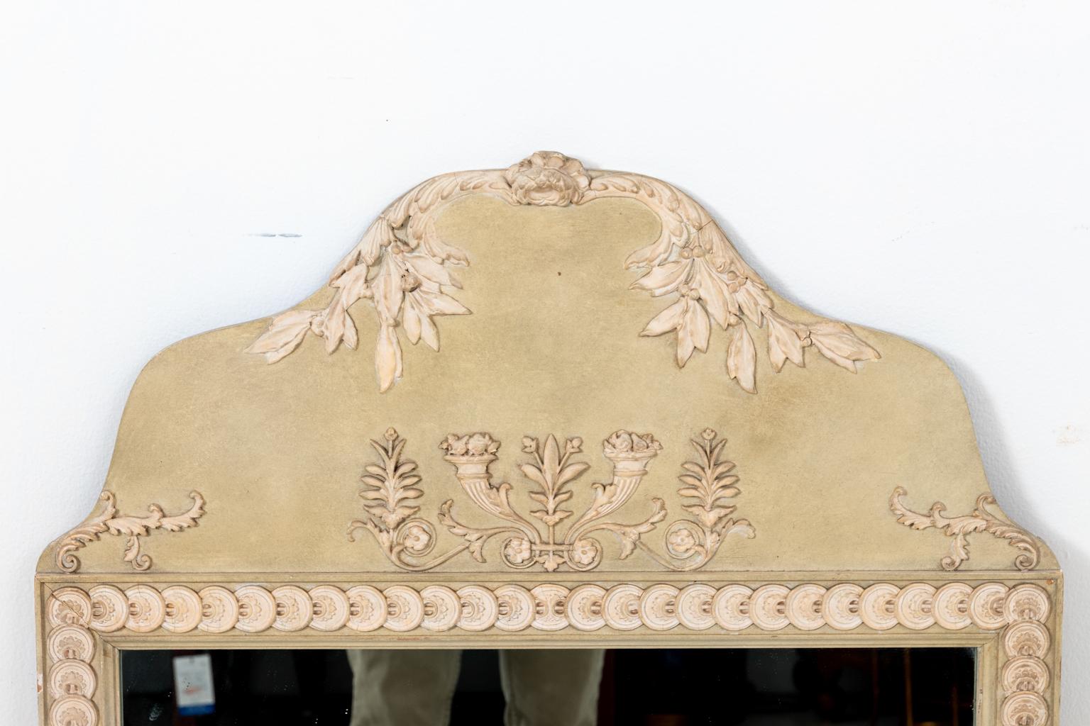 Antique French Louis XV celadon mirror with raised floral cream rosette, circa 1920s. The carved crown also features a raised cornucopia motif. Please note of wear consistent with age including minor paint loss. Made in France.
