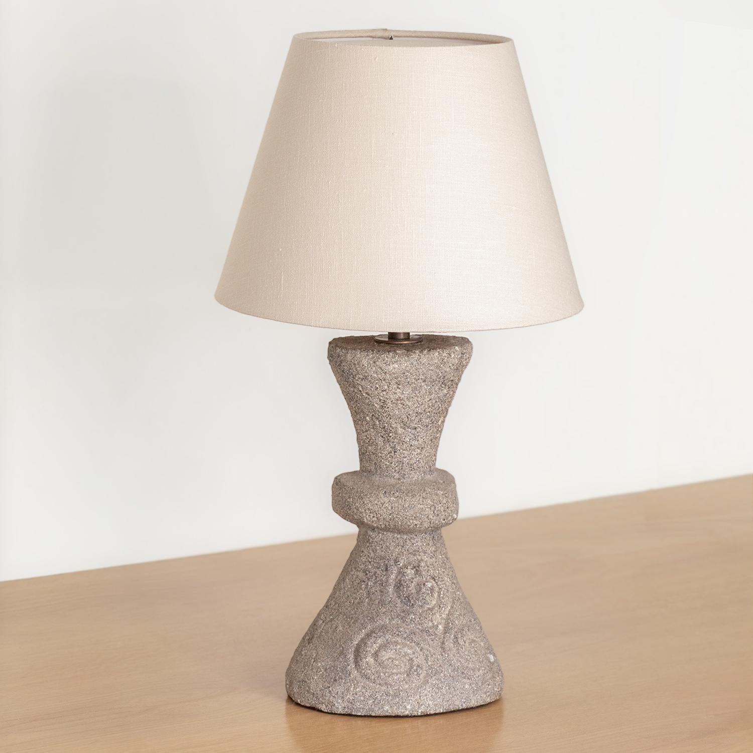 Vintage French cement table lamp with hand carved angular base with spiral detail in stone. New off-white tapered linen shade and newly re-wired.

Measures: 
Base - 7.5 W