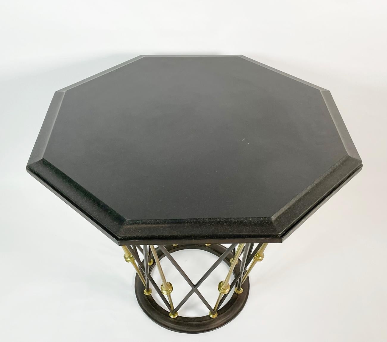 Stunningly beautiful center table made in France.
The table's base is made in a combination of wrought iron and solid brass laticced giving it a very unique look.

The top has an octagonal shape encasing a black slate top.

Measurements:
40