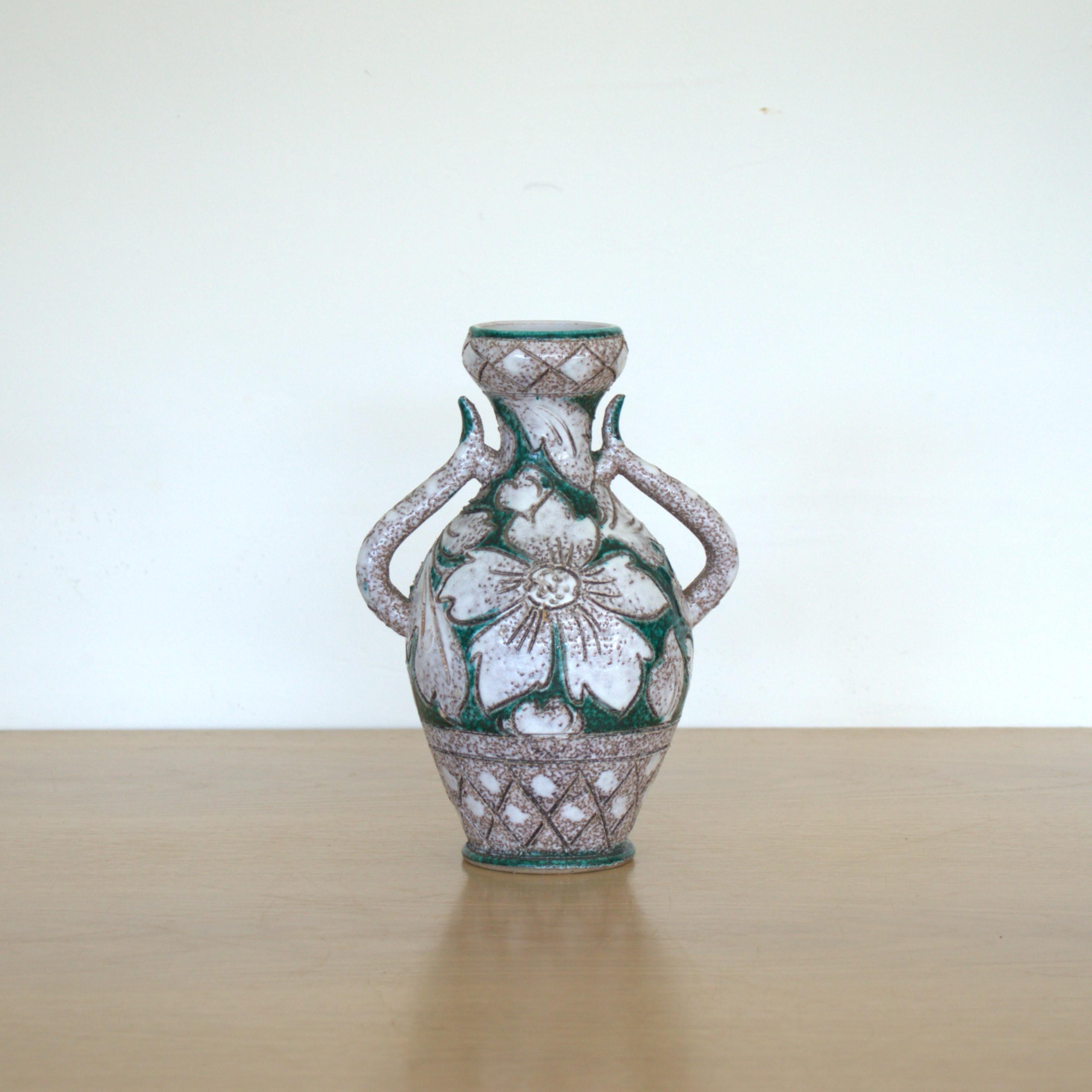 Beautiful ceramic vase from France, 1960s. Handmade amphora shape with off white glaze and painted green and brown with etched floral motif. 