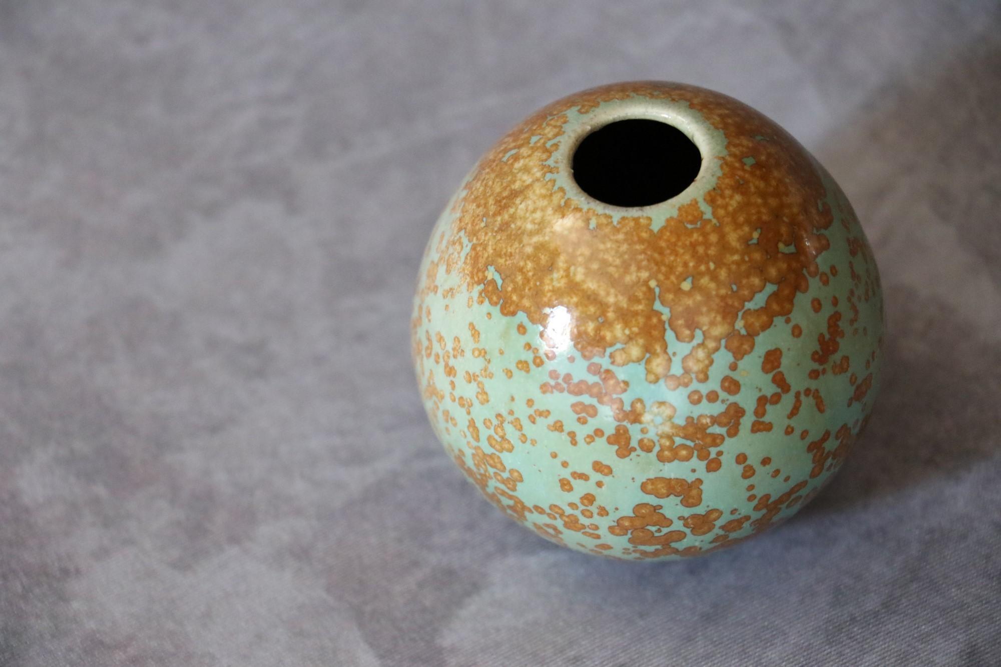 French ceramic ball vase with nucleations by Monique Cavallini - Circa 2000

Very delicately glazed ball vase in soft plant-inspired tones: earthy brown and leafy green. The vase is glazed with nucleations, similar to crystallizations, obtained