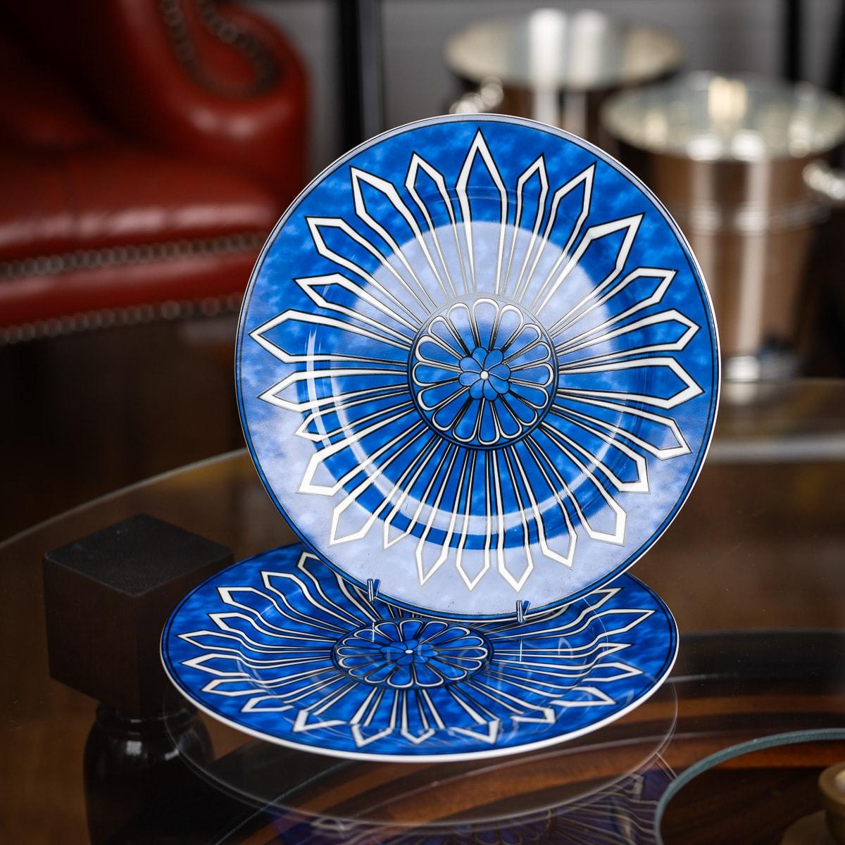 Hermès' Bleus d’Ailleurs pair of dinner plates, crafted in France from blue and white porcelain, showcases a geometric design inspired by ancient pottery. These classic hues symbolize centuries of travel between Europe and Asia.

The designs are