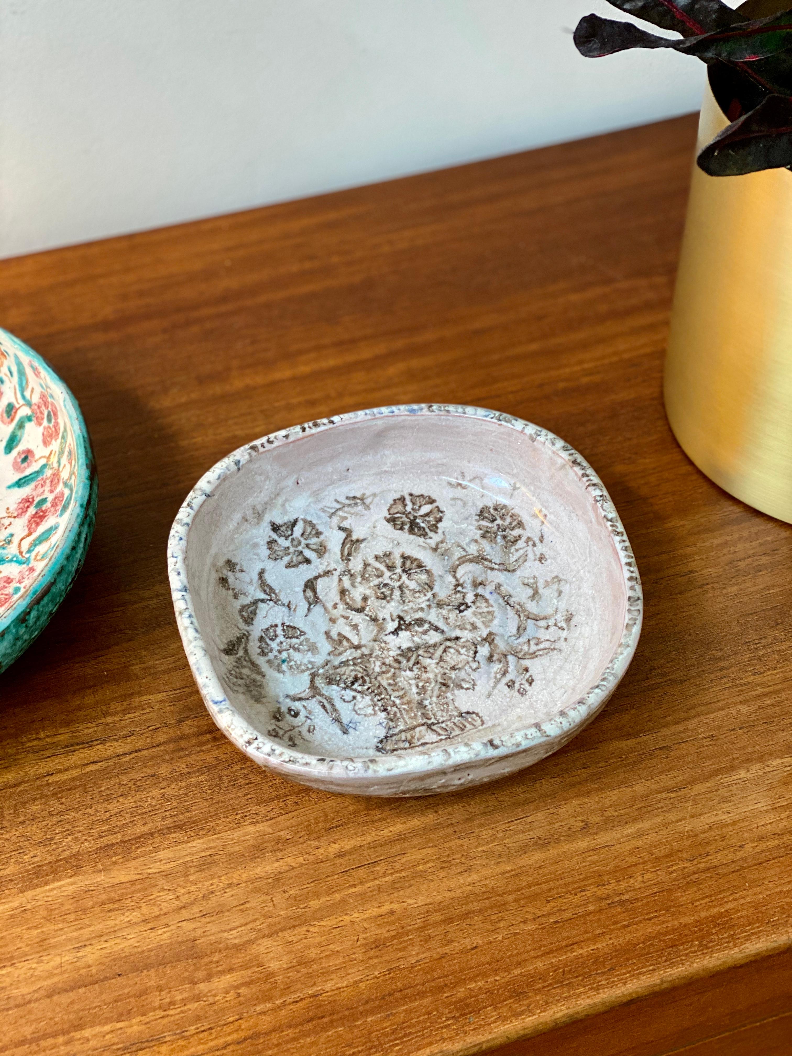 French ceramic bowl by Edouard Cazaux, circa 1930s. Master ceramicist, Édouard Cazaux, was inspired by antiquities, religion and animal life in his creations. This magnificently decorated ceramic dish displays a traditional European vase with a