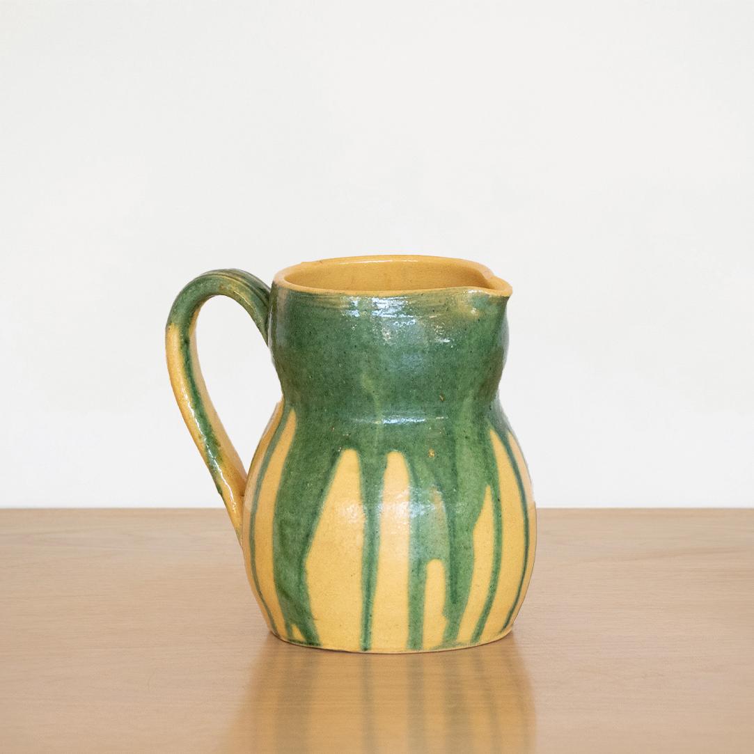 Vintage French ceramic carafe with handle in a beautiful yellow and green glaze. Nice vintage condition.