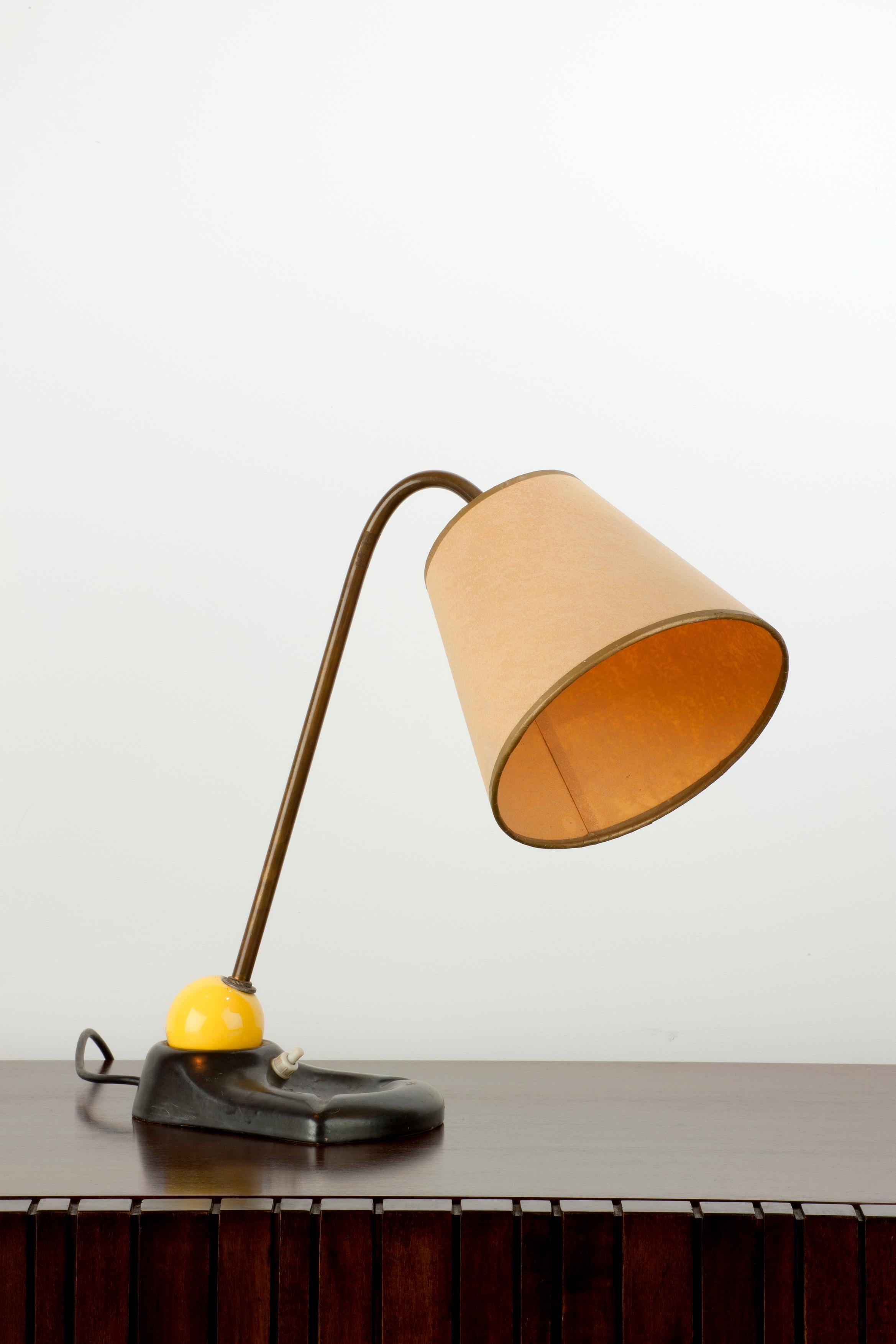 Unusual French ceramic table lamp with brass stem and ceramic base in black and yellow.