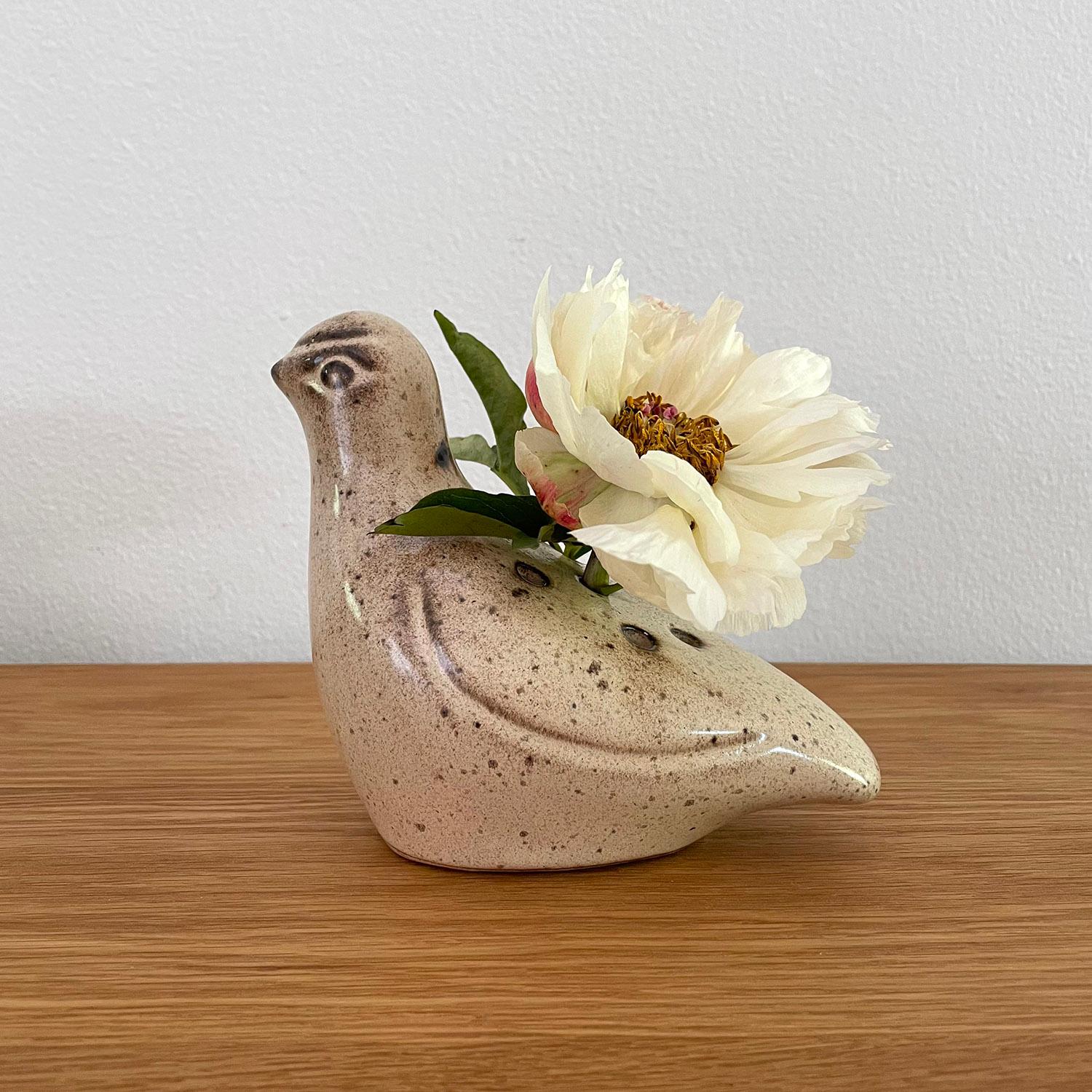French ceramic dove vase
France, circa 1960’s
Doves are often declared messengers and symbols of love and peace
Petite vase with frog holes for optimal flower arrangement
Patina from age and use
Vessel has not been tested to hold water