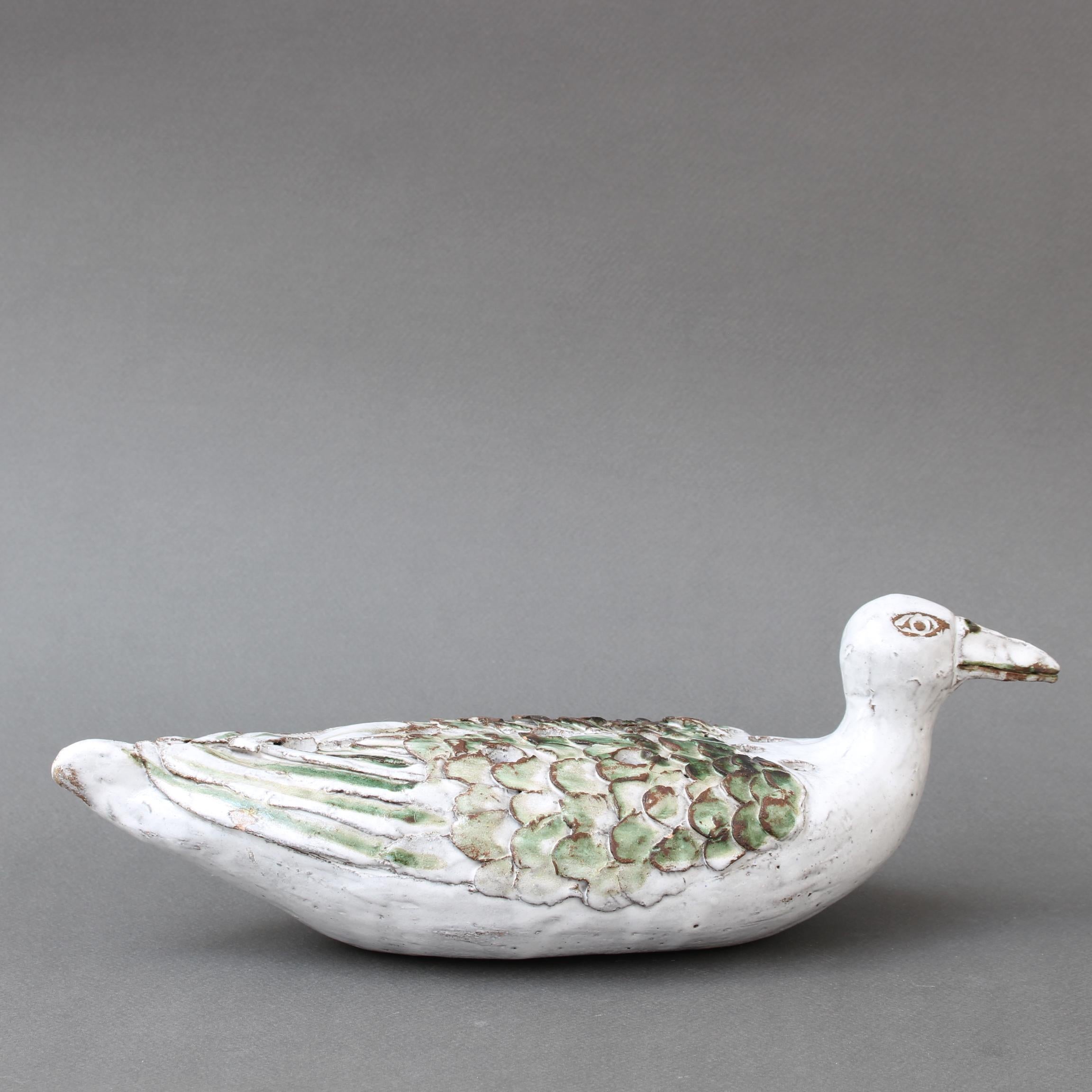 French ceramic duck flower vase (1994) by Albert Thiry. A creamy-white glaze contrasts with a delicate green which progresses in intensity on the piece's wings. The markings and colouring are quintessential Albert Thiry. The individual flower holes