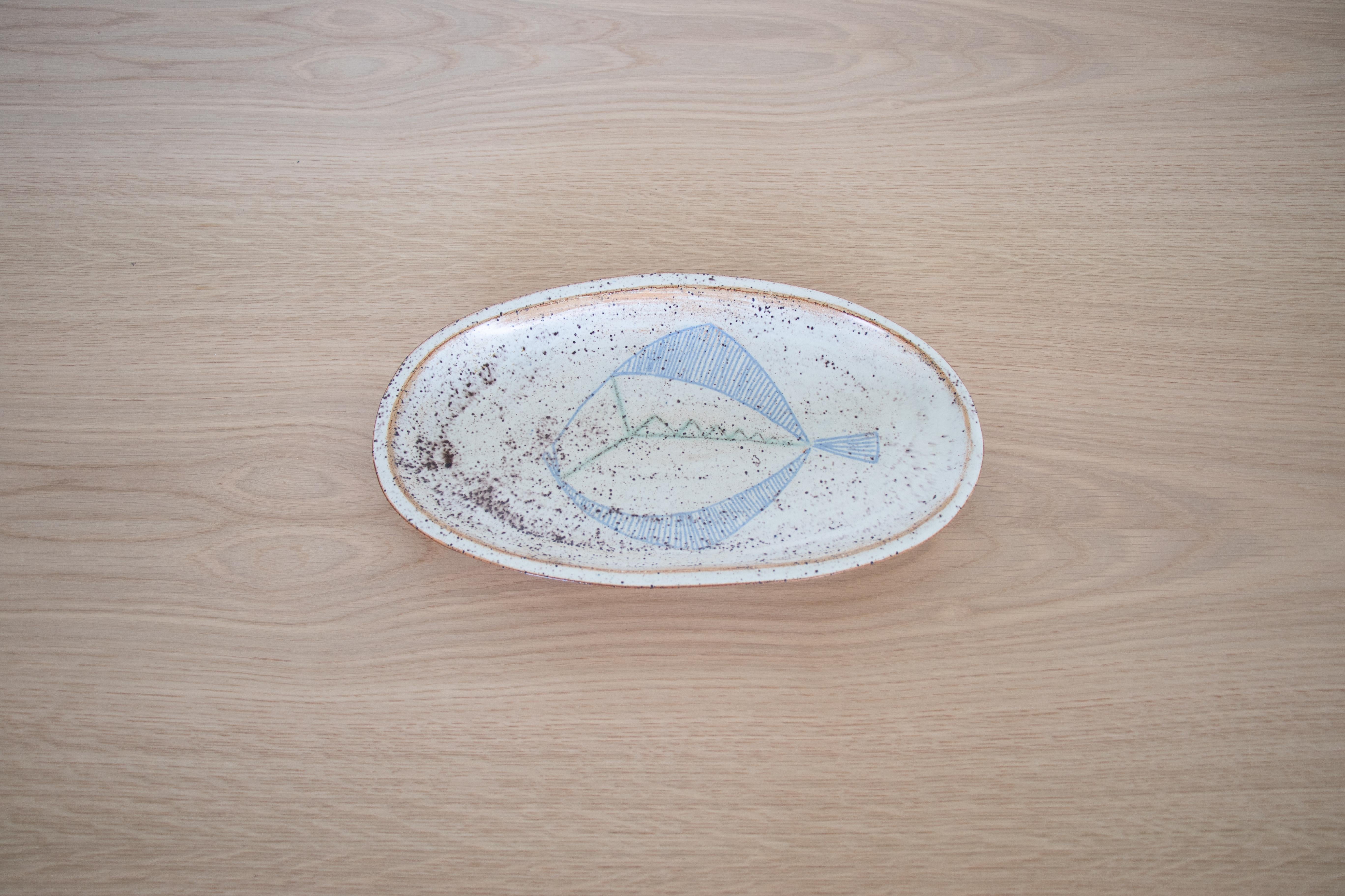 French ceramic dish with hand painted fish motif. Beautiful cream, blue, and brown coloring. Great as a platter or catch-all.